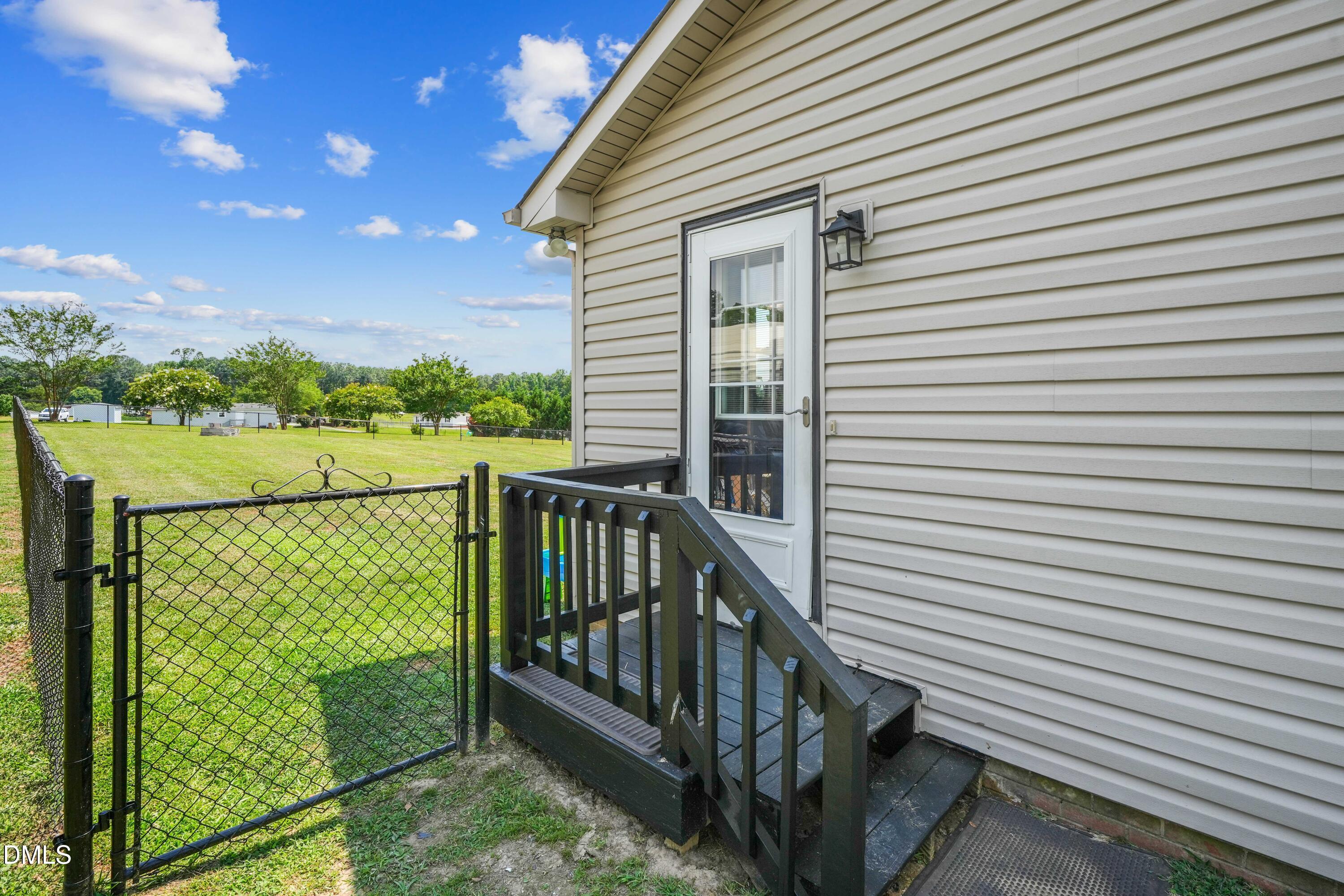 101 Stephenson Road Benson, NC 27504 - Photo 22 of 29 a view of a balcony with wooden fence
