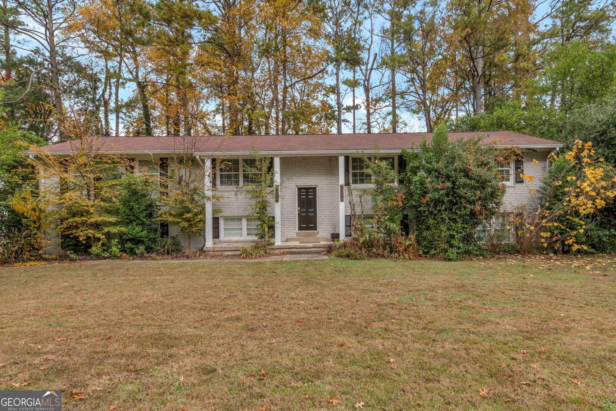 front view of a house with a garden