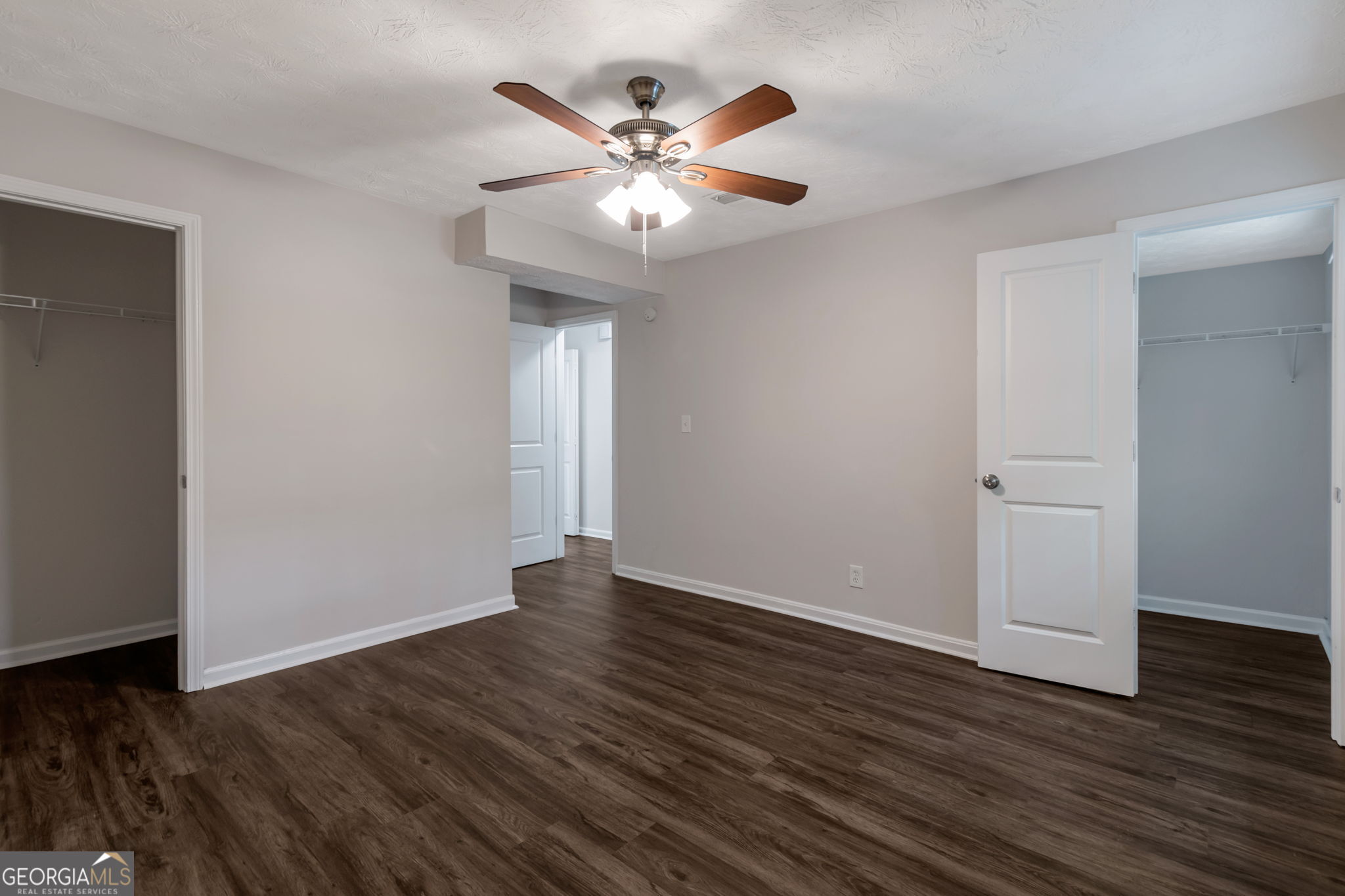 2364 Peachwood Circle Northeast, Unit 2366B Atlanta, GA 30345 - Photo 11 of 15 a view of an empty room with wooden floor