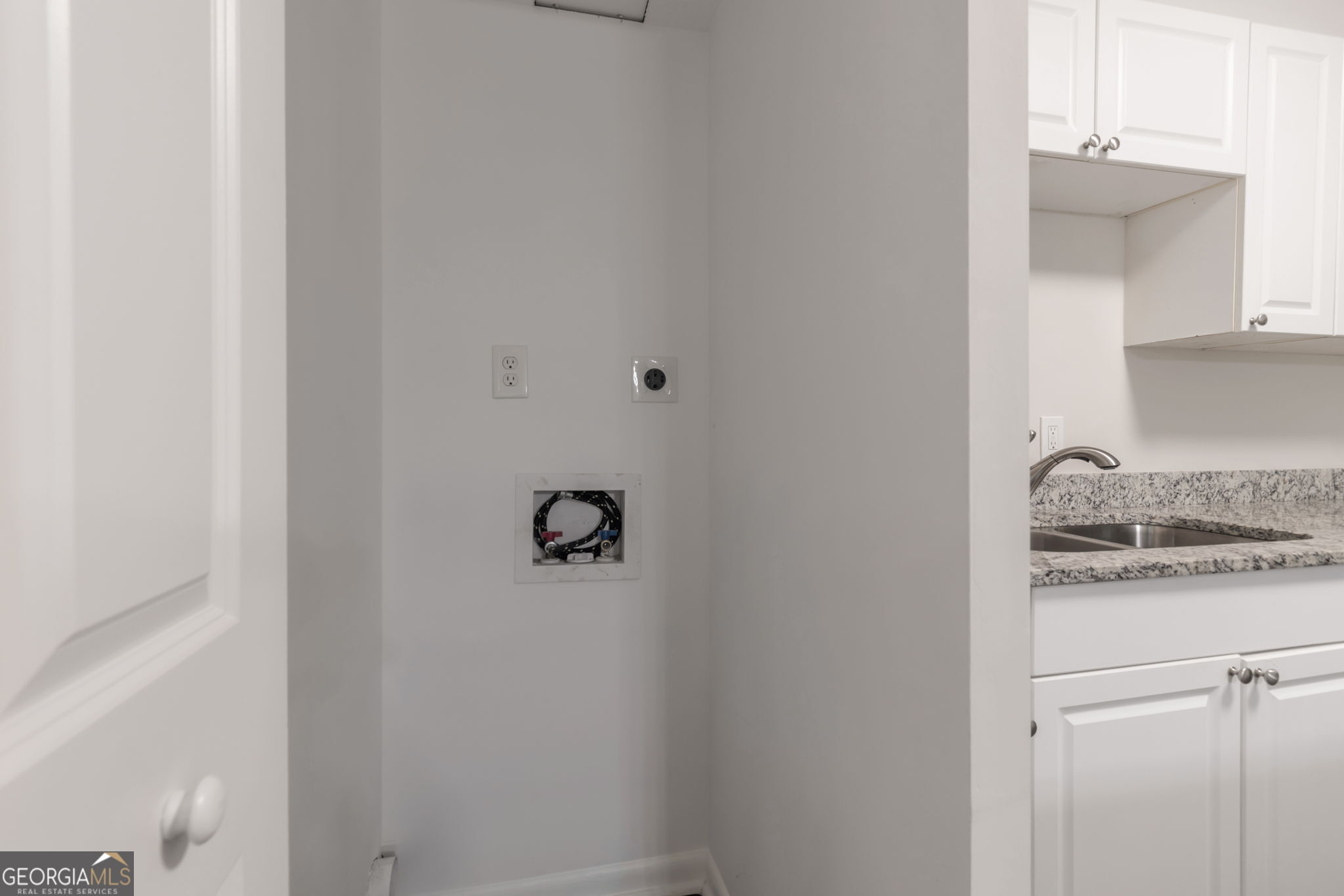 2364 Peachwood Circle Northeast, Unit 2366B Atlanta, GA 30345 - Photo 7 of 15 a bathroom with a granite countertop sink and vanity