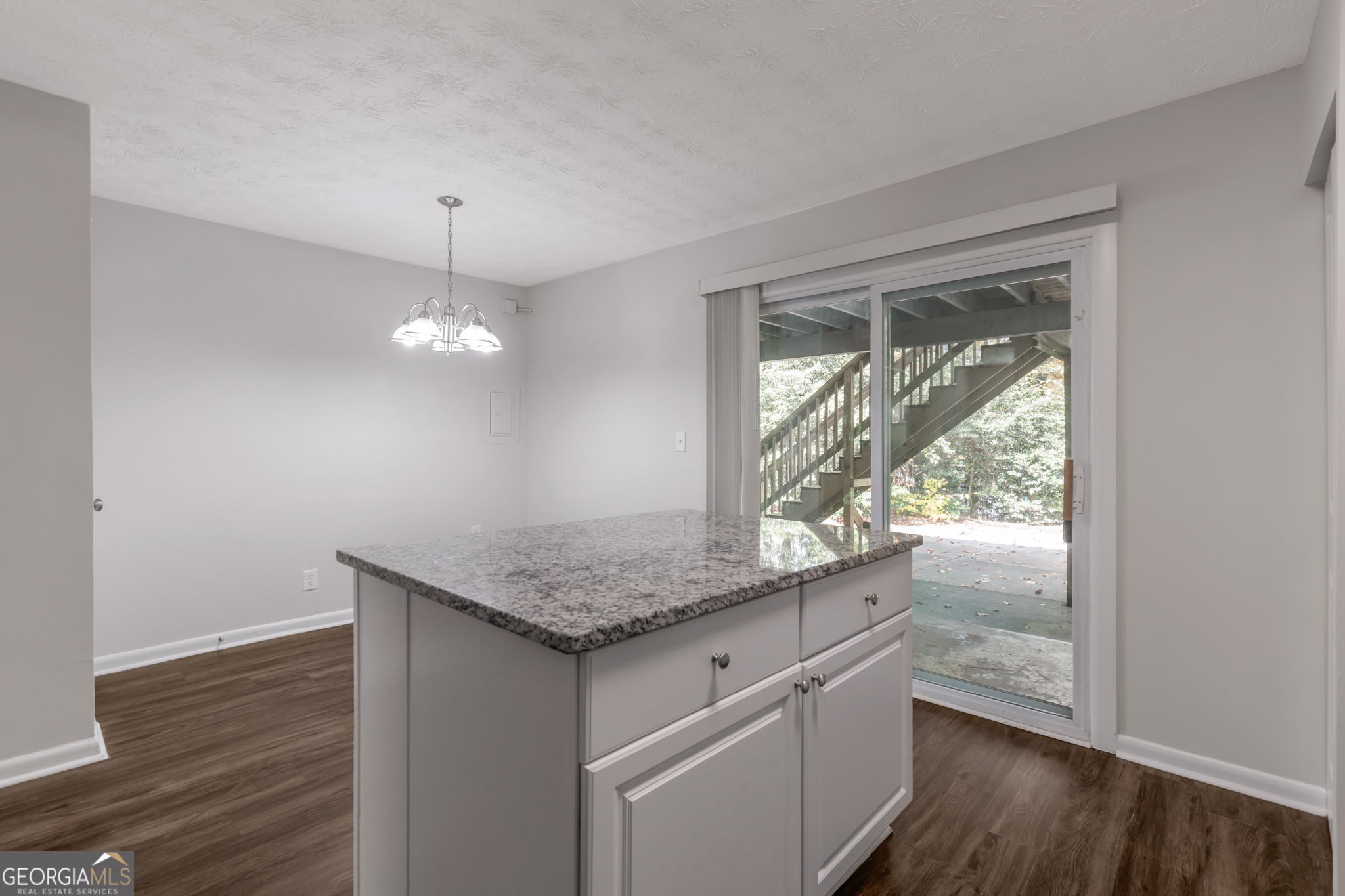 2364 Peachwood Circle Northeast, Unit 2366B Atlanta, GA 30345 - Photo 9 of 15 a kitchen with a sink a window and wooden floor