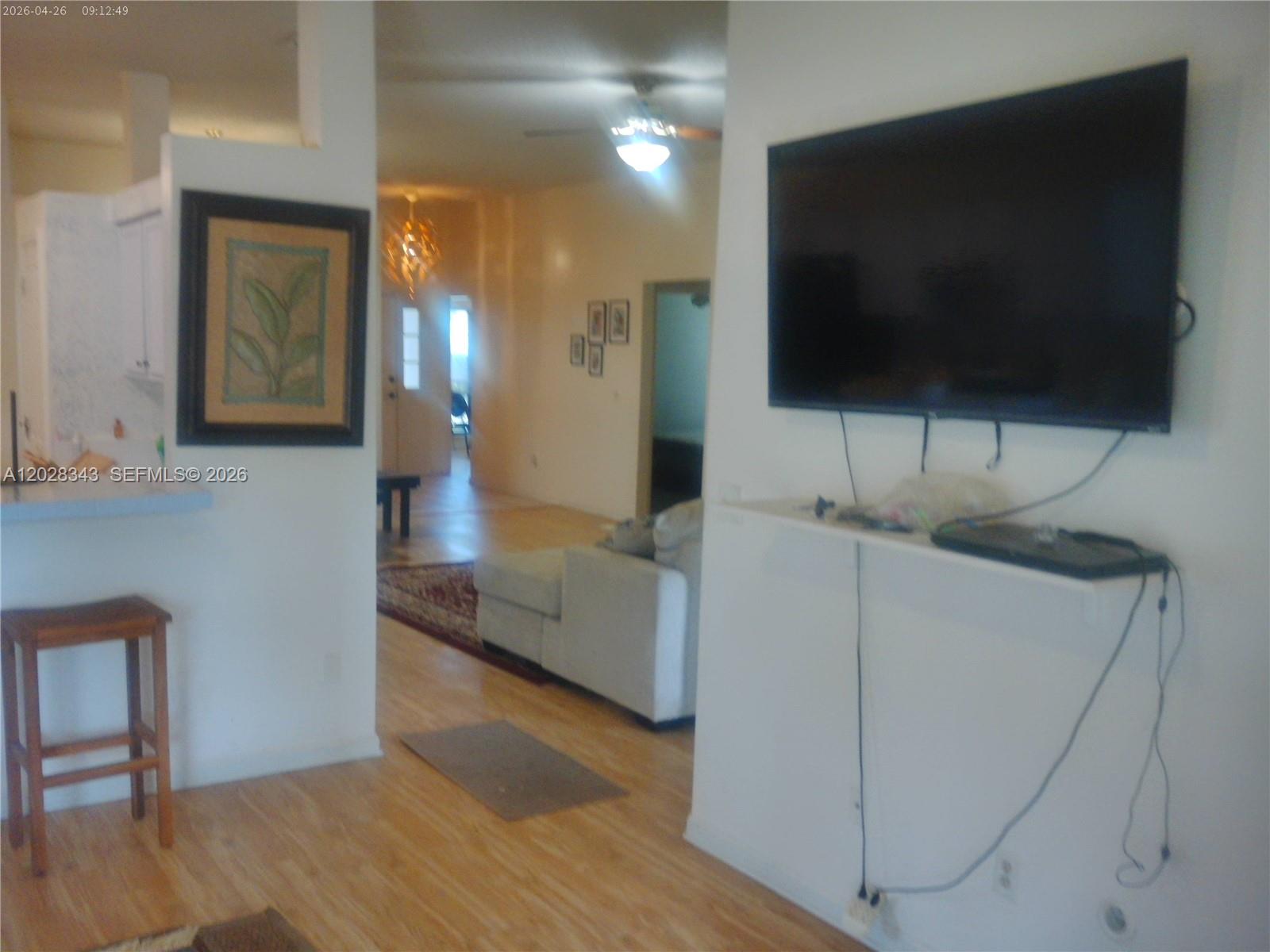 1641 Spring Oaks Lane Jacksonville, FL 32221 - Photo 35 of 44 a living room with furniture and a flat screen tv