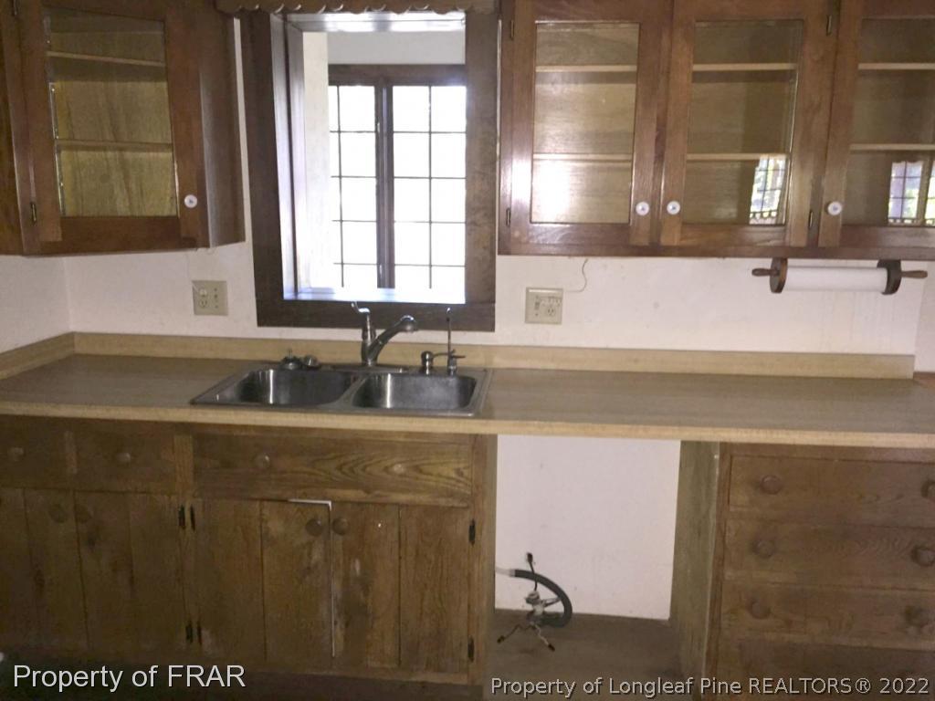 4949 Niagara Carthage Road Southern Pines, NC 28387 - Photo 6 of 18 a bathroom with a sink and a vanity