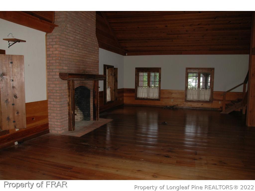 4949 Niagara Carthage Road Southern Pines, NC 28387 - Photo 7 of 18 a view of livingroom with furniture and fireplace