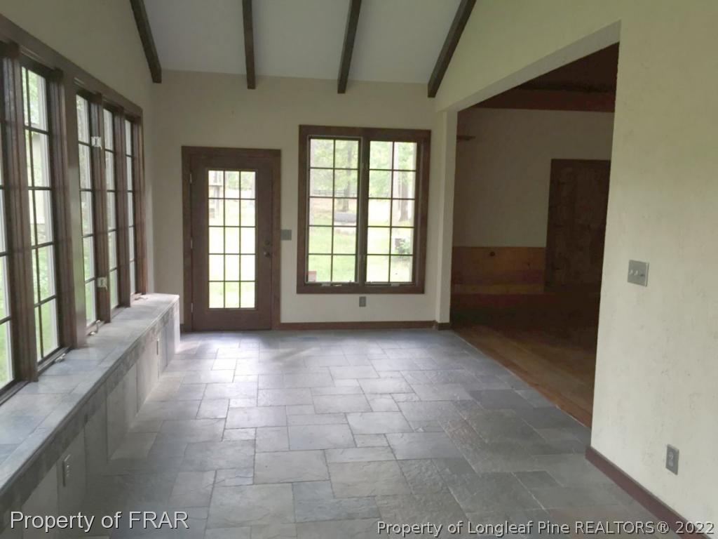 4949 Niagara Carthage Road Southern Pines, NC 28387 - Photo 8 of 18 a view of an empty room with a fireplace