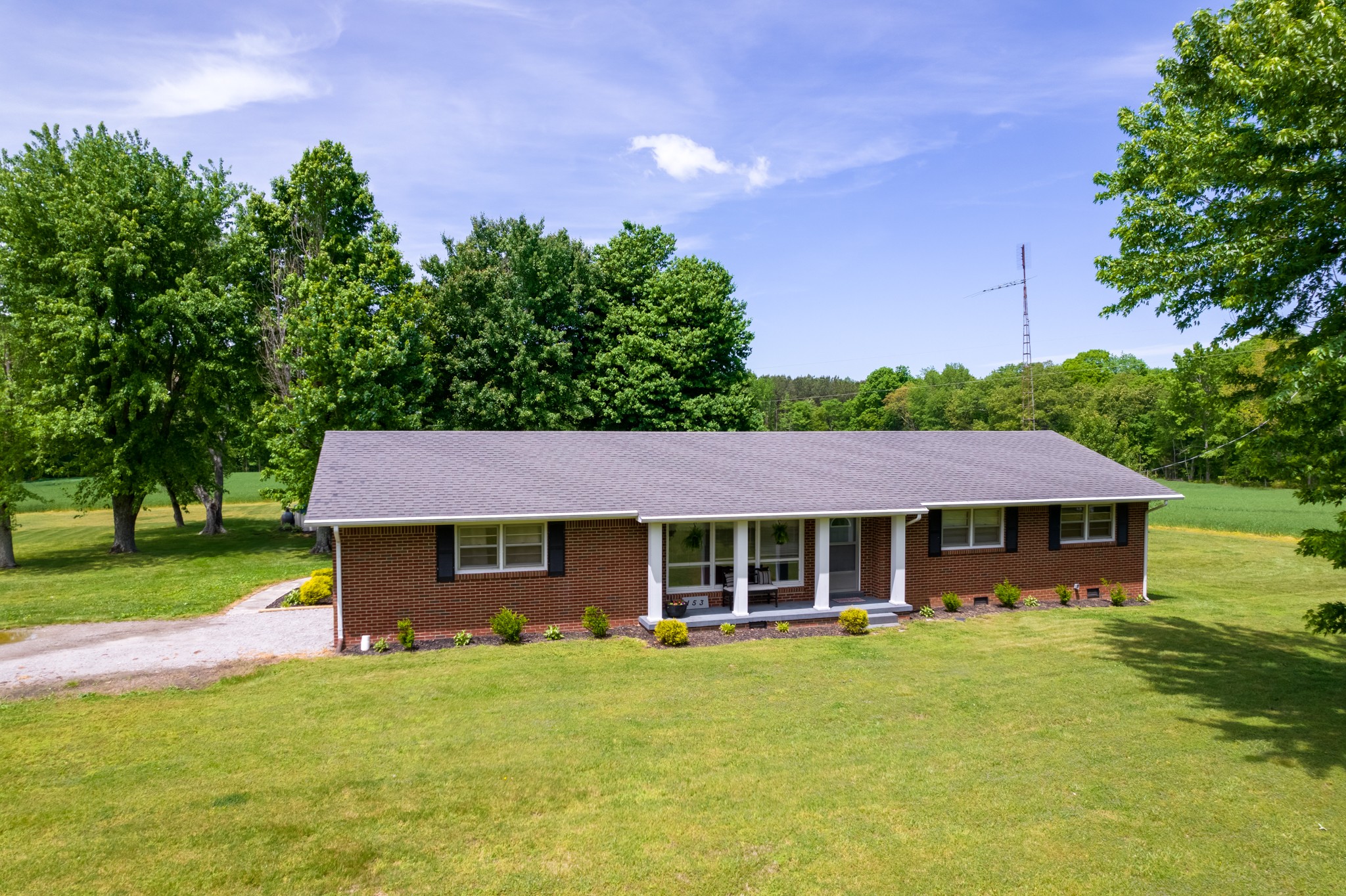 153 Westside Road Lawrenceburg, TN 38464 - Photo 1 of 37 a front view of a house with a garden
