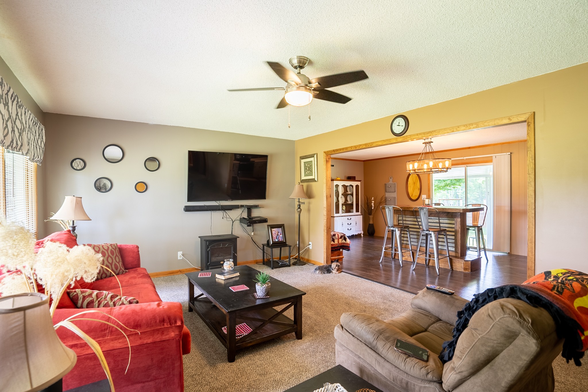 153 Westside Road Lawrenceburg, TN 38464 - Photo 33 of 37 a living room with furniture a flat screen tv and a large window