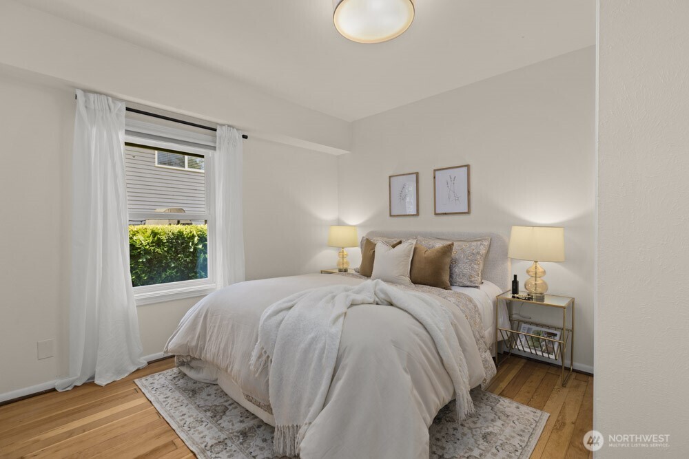 4146 47th Avenue Southwest Seattle, WA 98116 - Photo 15 of 40 a bedroom with a bed and a window