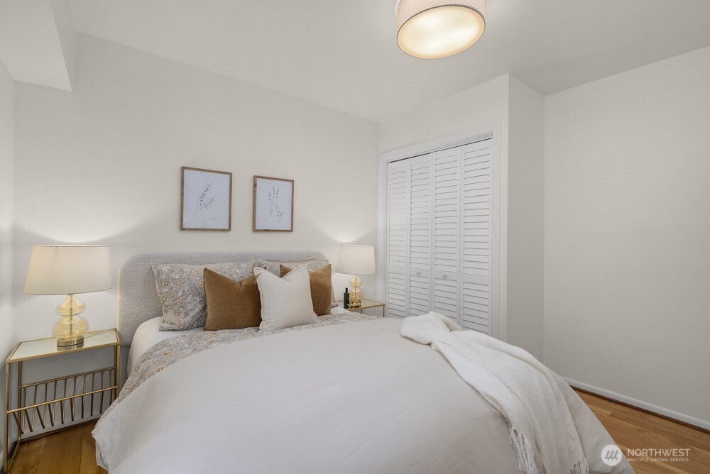 4146 47th Avenue Southwest Seattle, WA 98116 - Photo 16 of 40 a bedroom with a bed and a lamp