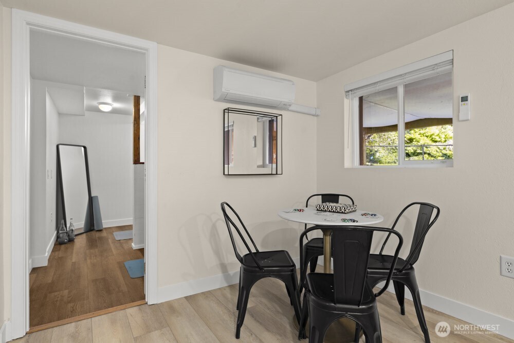4146 47th Avenue Southwest Seattle, WA 98116 - Photo 21 of 40 a view of a dining room with furniture and a potted plant
