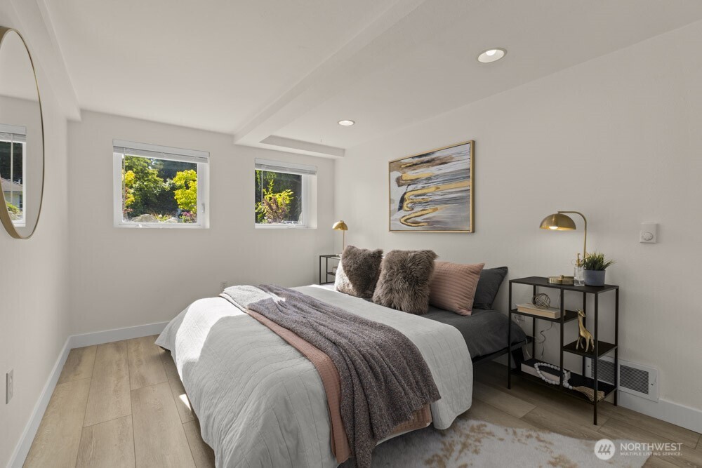 4146 47th Avenue Southwest Seattle, WA 98116 - Photo 25 of 40 a bedroom with a bed and painting on the wall