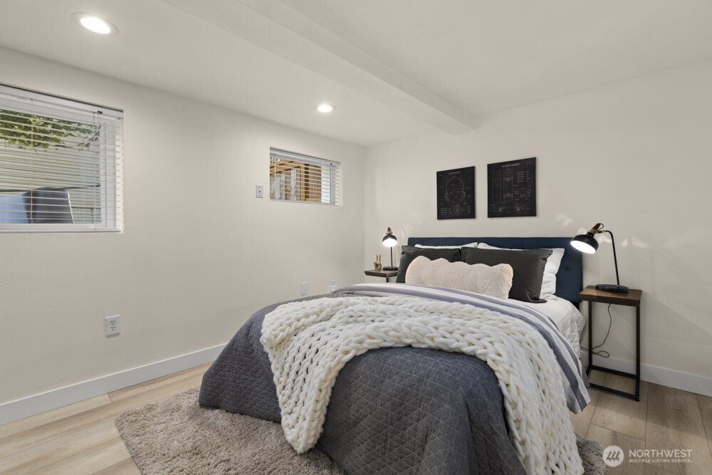 4146 47th Avenue Southwest Seattle, WA 98116 - Photo 27 of 40 a bedroom with bed and a night stand