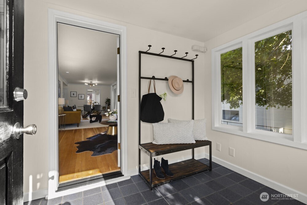 4146 47th Avenue Southwest Seattle, WA 98116 - Photo 3 of 40 a view of entryway with wooden floor and a bathroom view