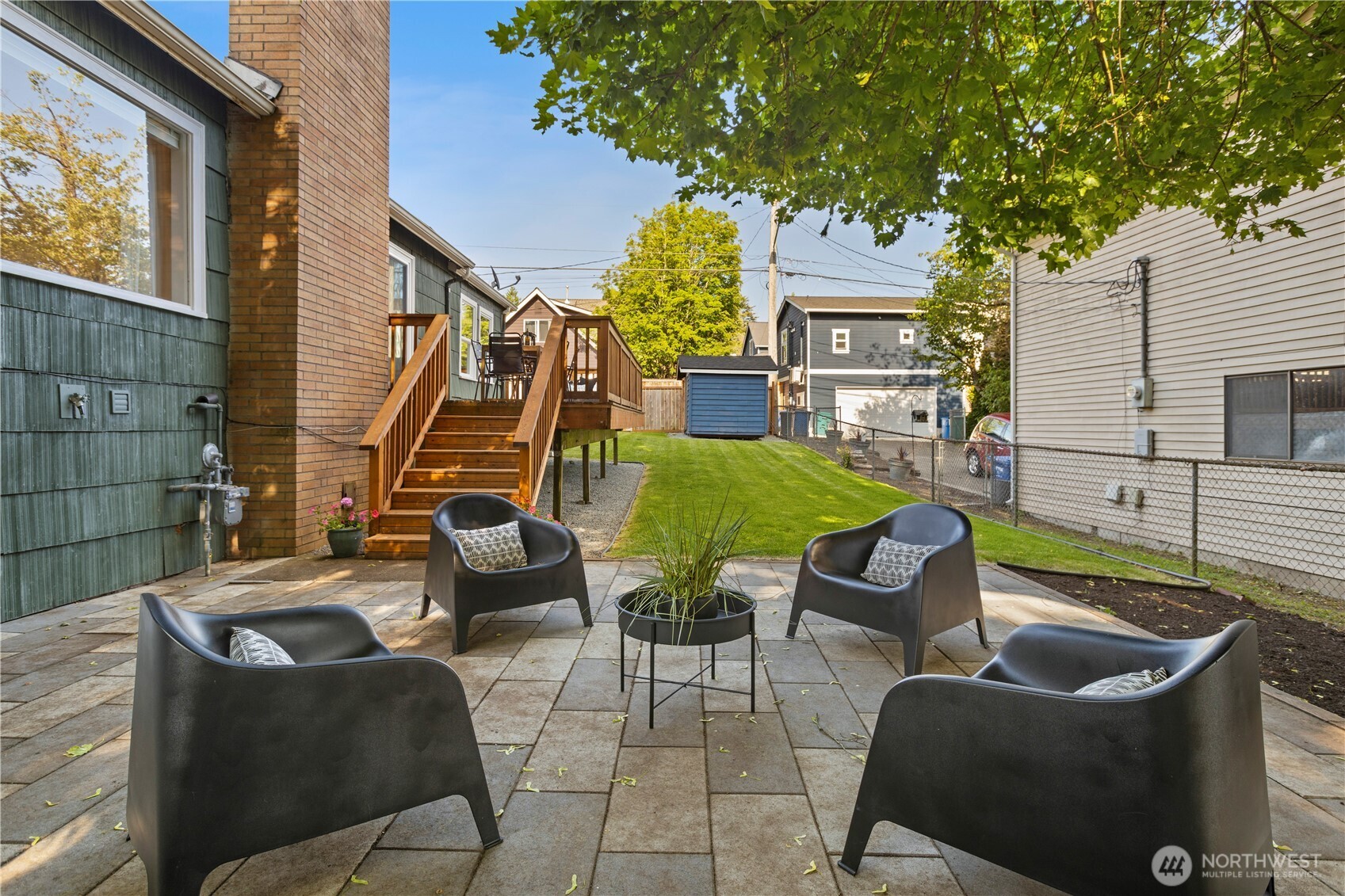4146 47th Avenue Southwest Seattle, WA 98116 - Photo 32 of 40 a view of a patio with couches chairs and a potted plant