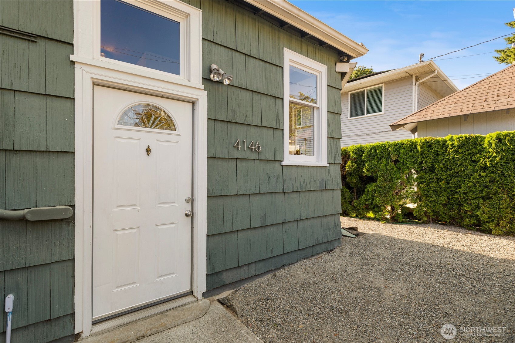 4146 47th Avenue Southwest Seattle, WA 98116 - Photo 36 of 40 a front view of a house with a garage