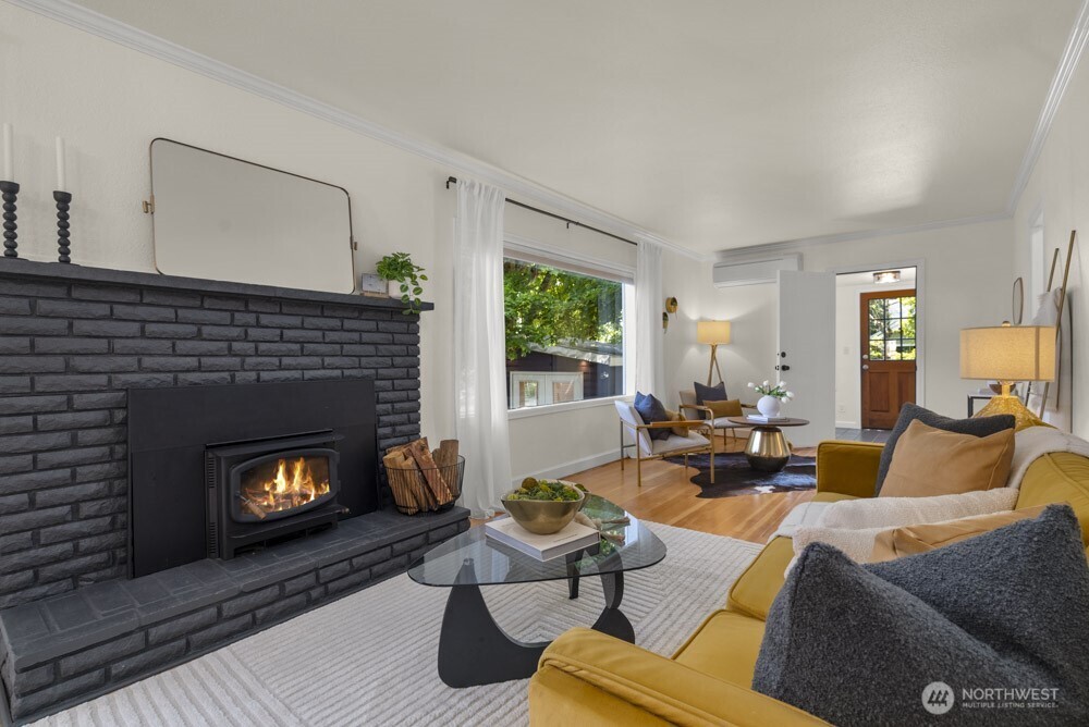 4146 47th Avenue Southwest Seattle, WA 98116 - Photo 6 of 40 a living room with furniture fireplace and window