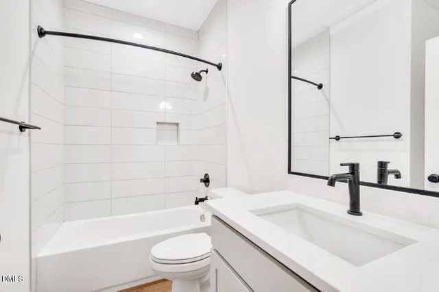 a bathroom with a sink a toilet and a bathtub