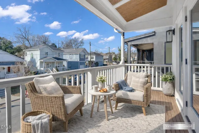 a view of a balcony with furniture