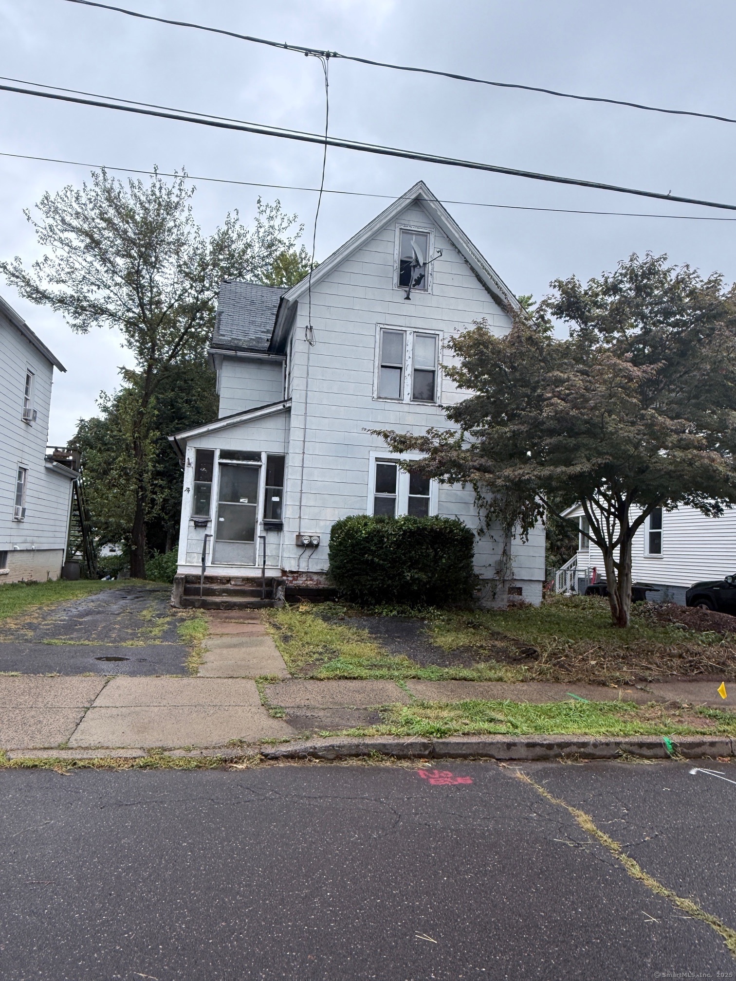 a view of a house with a street