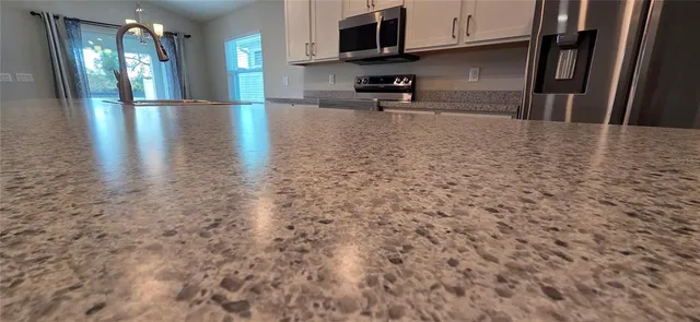 a view of a kitchen with a sink