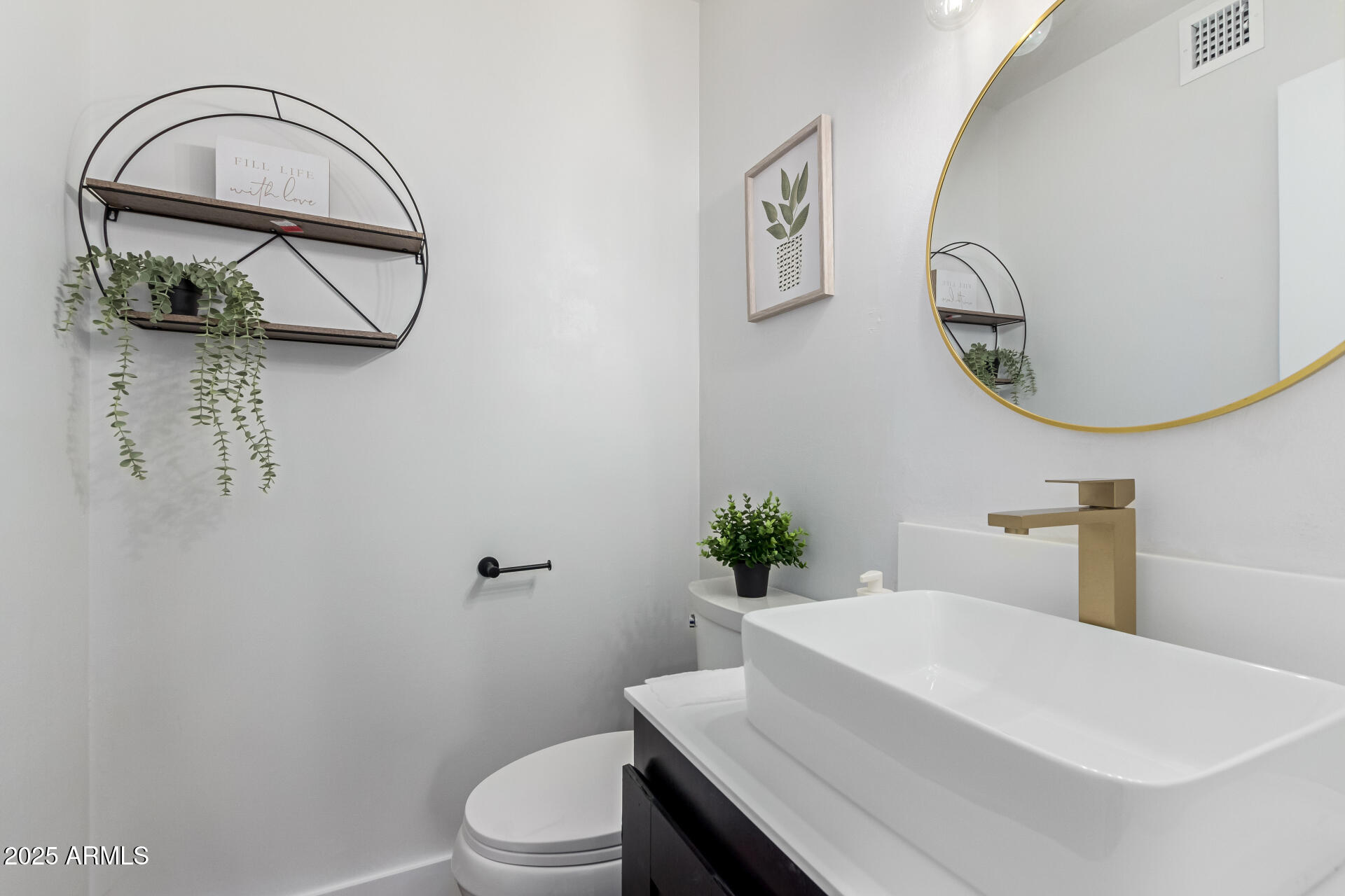628 Leisure World Mesa, AZ 85206 - Photo 13 of 51 a bathroom with a toilet a sink and mirror