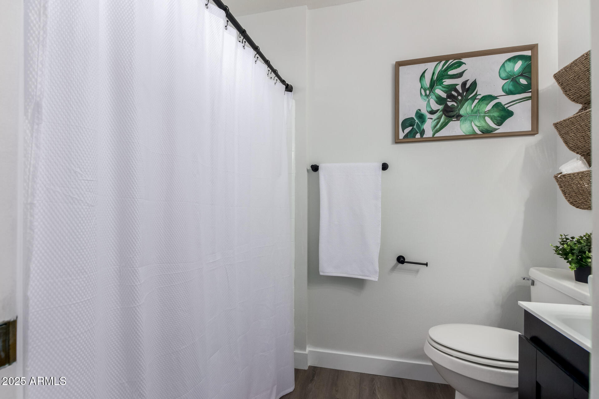 628 Leisure World Mesa, AZ 85206 - Photo 21 of 51 a white toilet sitting next to a shower curtain