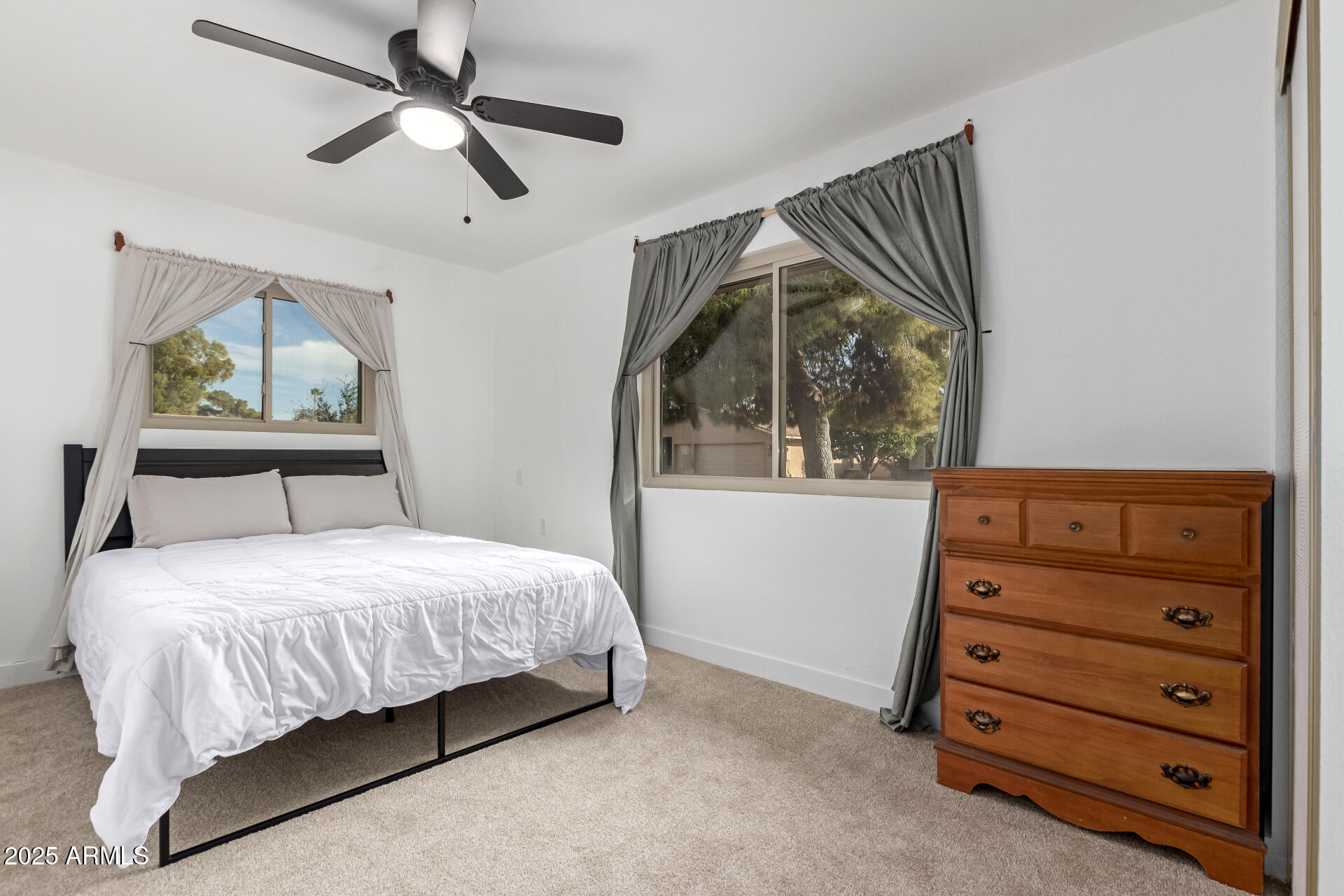 628 Leisure World Mesa, AZ 85206 - Photo 22 of 51 a bedroom with a bed and a mirror on the dresser