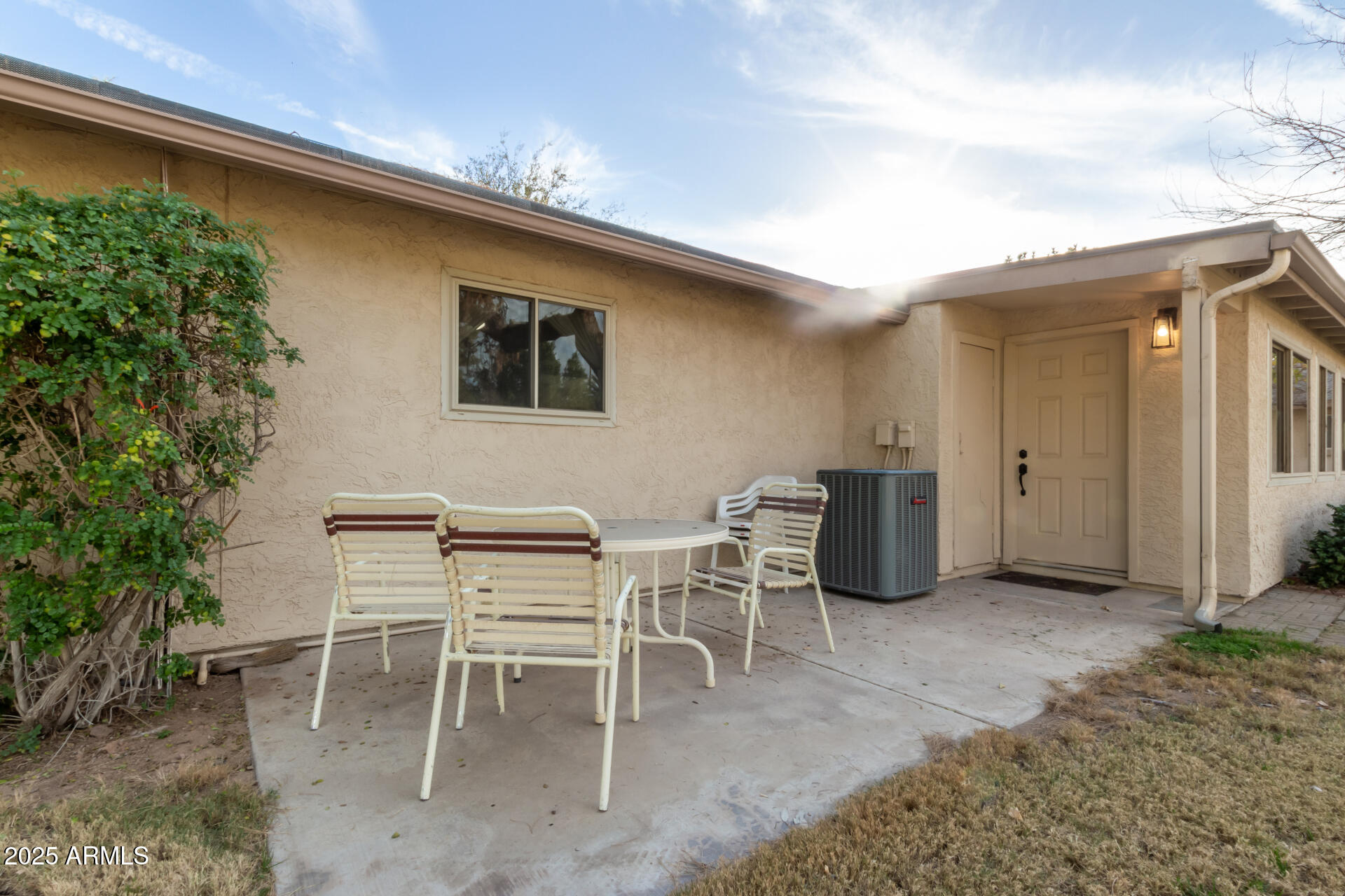 628 Leisure World Mesa, AZ 85206 - Photo 36 of 51 a view of a chairs and table in a backyard