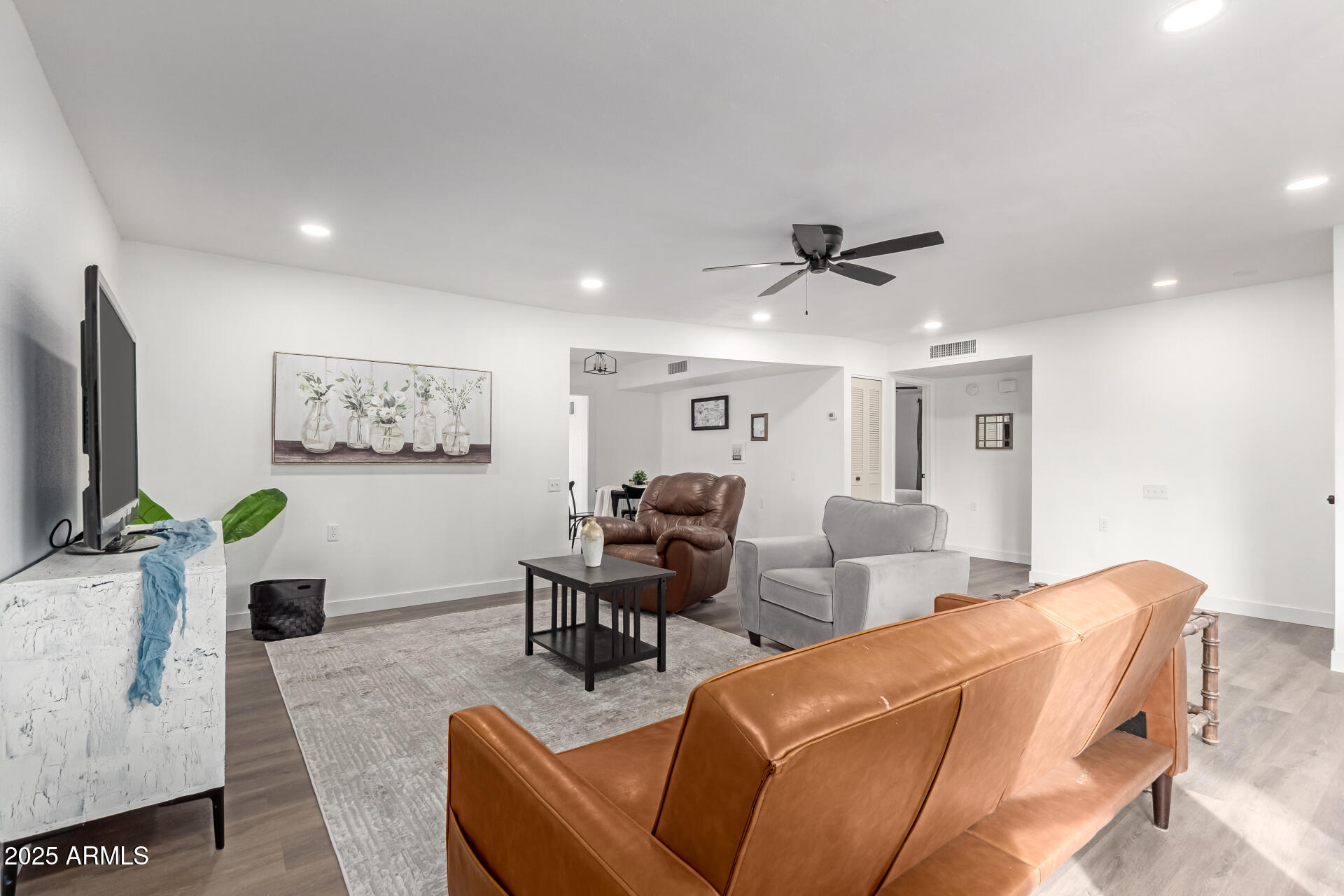628 Leisure World Mesa, AZ 85206 - Photo 6 of 51 a living room with furniture and a flat screen tv