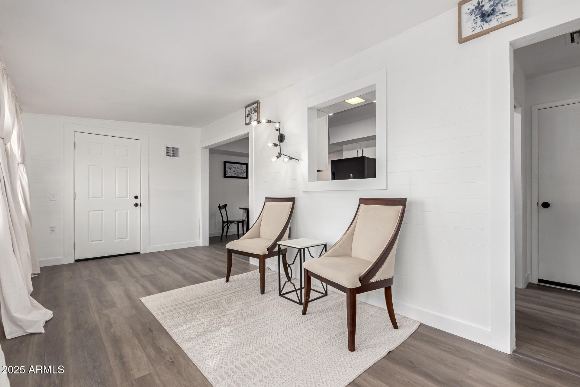 628 Leisure World Mesa, AZ 85206 - Photo 10 of 51 a view of a livingroom with furniture and wooden floor