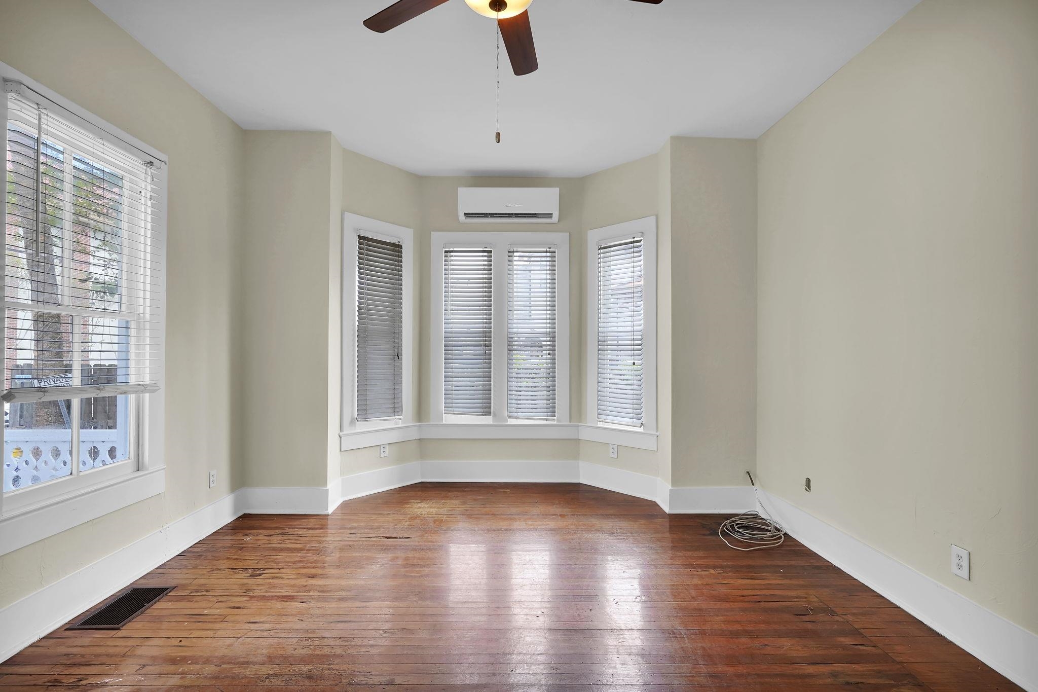 75 Cedar Street St. Augustine, FL 32084 - Photo 11 of 56 wooden floor in an empty room with a window
