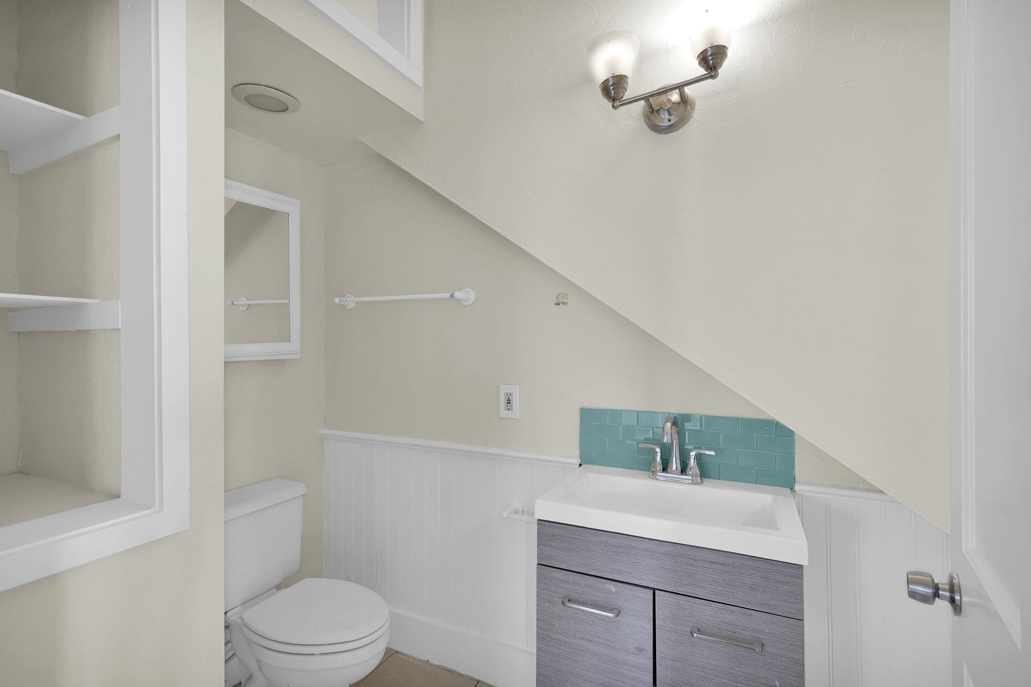 75 Cedar Street St. Augustine, FL 32084 - Photo 16 of 56 a bathroom with a sink a toilet and shower