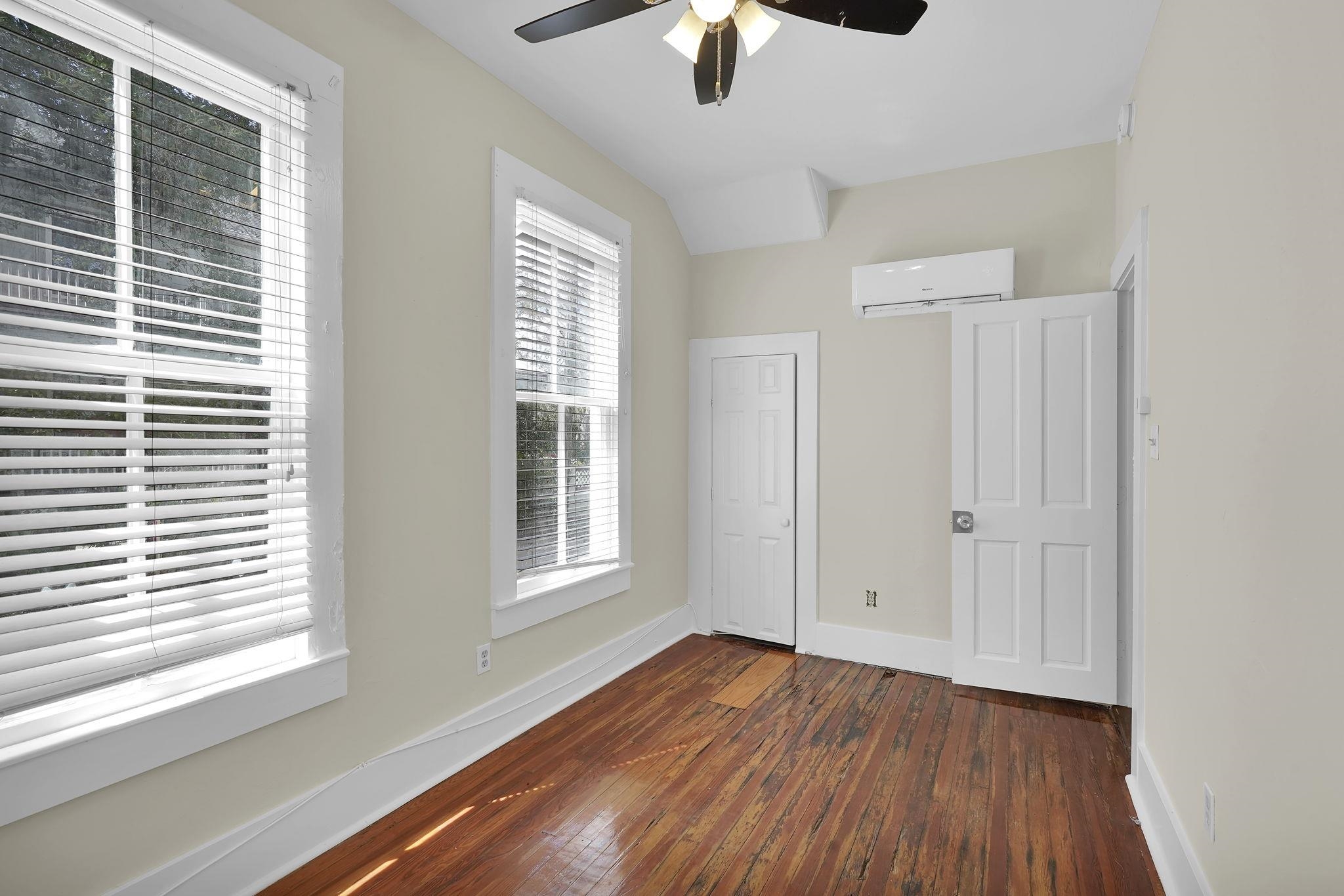 75 Cedar Street St. Augustine, FL 32084 - Photo 19 of 56 a view of an empty room with wooden floor and a window