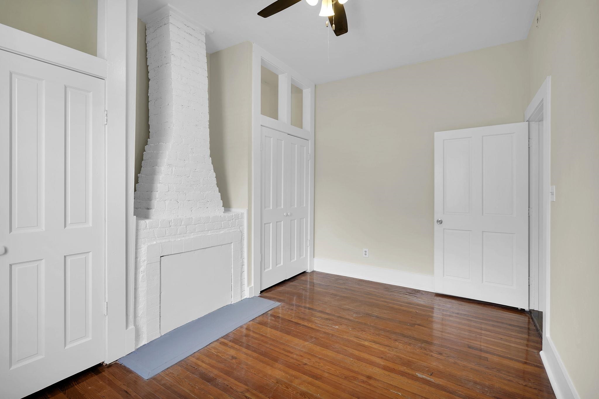 75 Cedar Street St. Augustine, FL 32084 - Photo 20 of 56 an empty room with wooden floor cabinet and windows