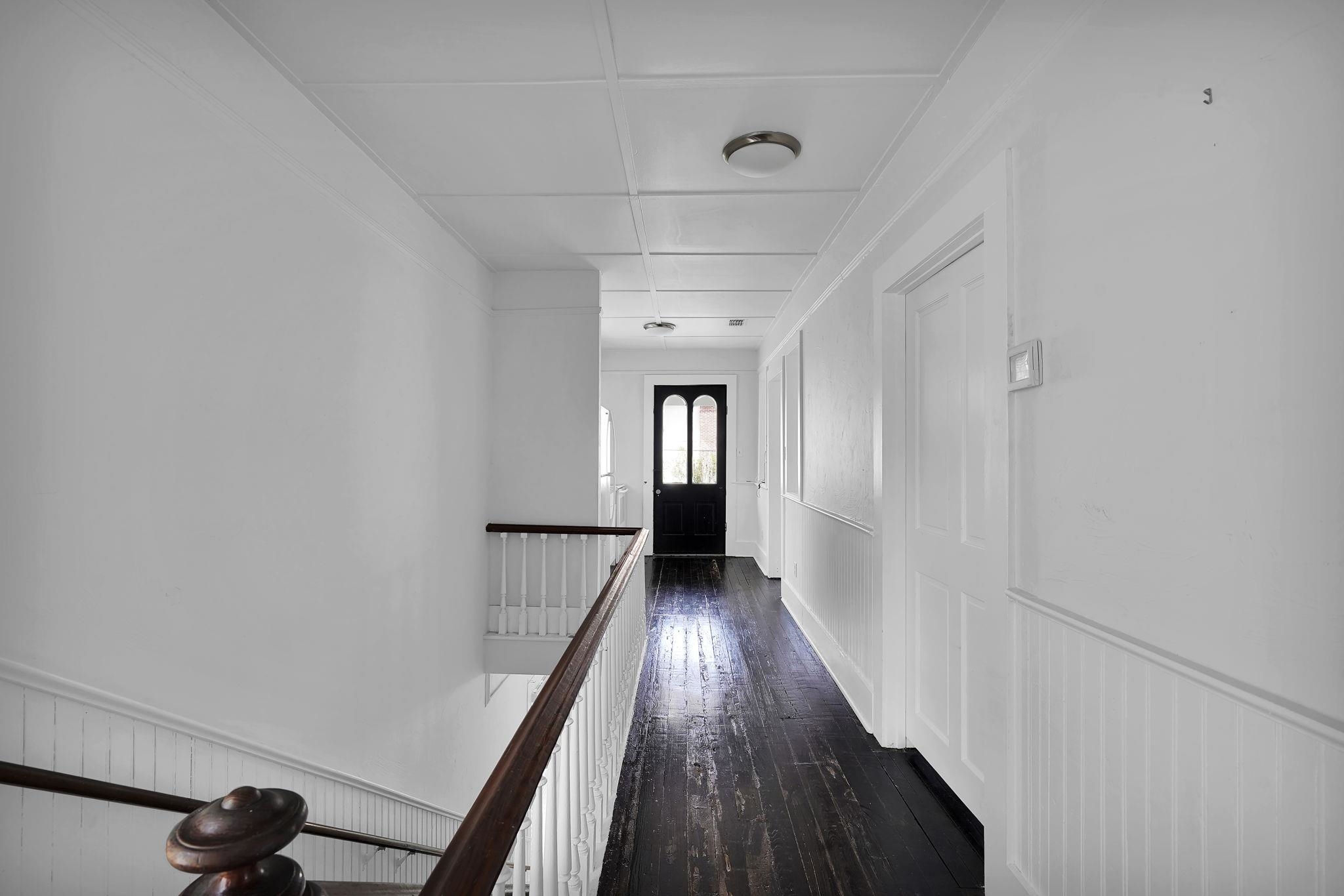 75 Cedar Street St. Augustine, FL 32084 - Photo 25 of 56 a view of a hallway with wooden floor