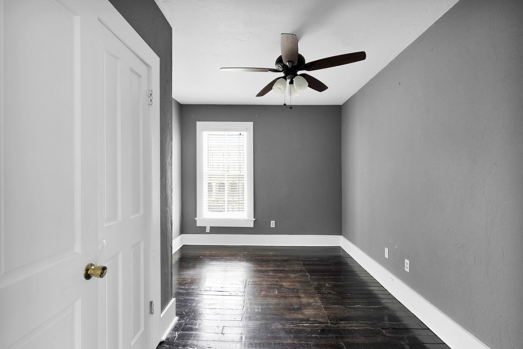 75 Cedar Street St. Augustine, FL 32084 - Photo 28 of 56 a view of an empty room with wooden floor and a window