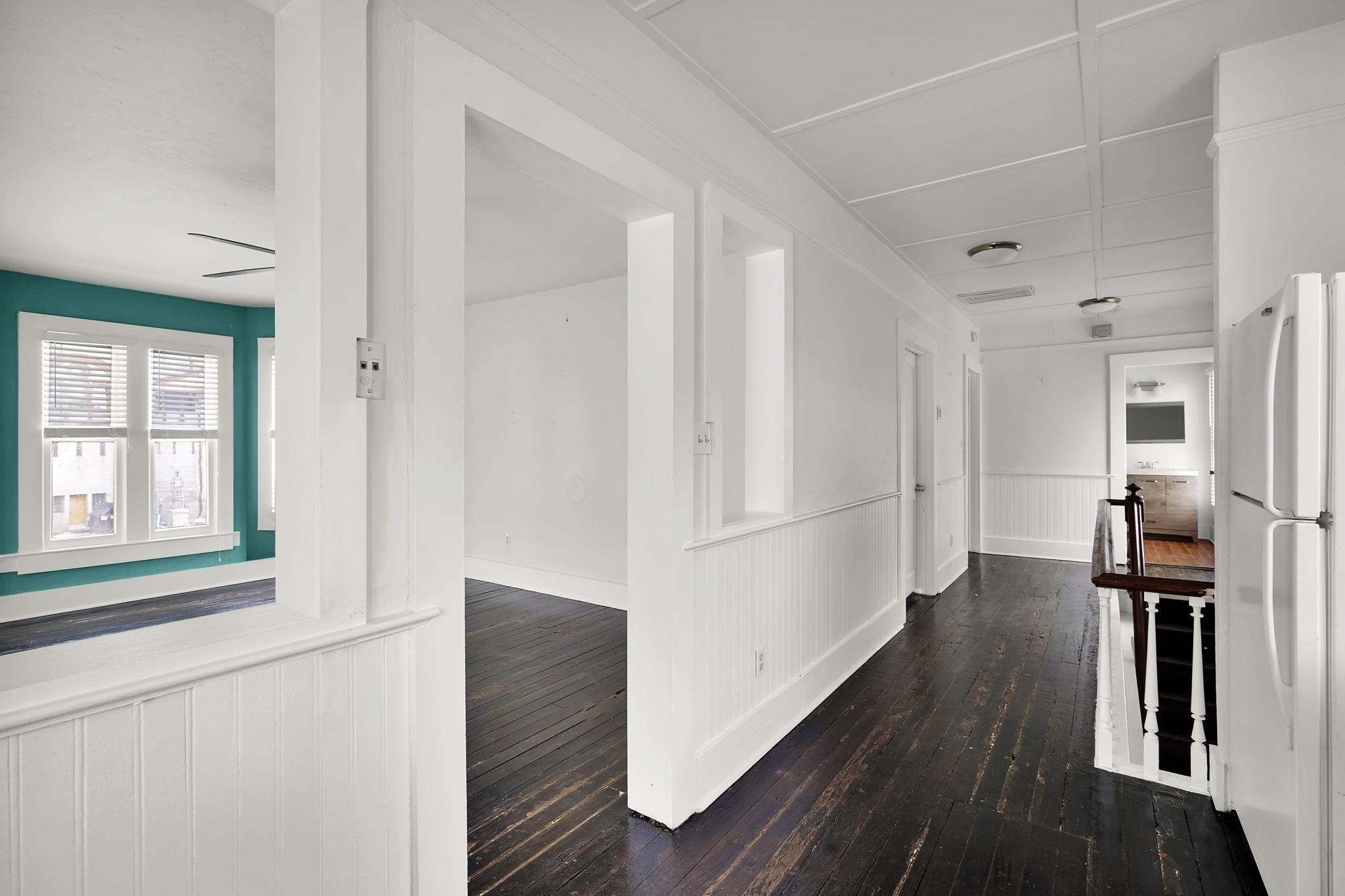 75 Cedar Street St. Augustine, FL 32084 - Photo 32 of 56 a view of a hallway with wooden floor and staircase