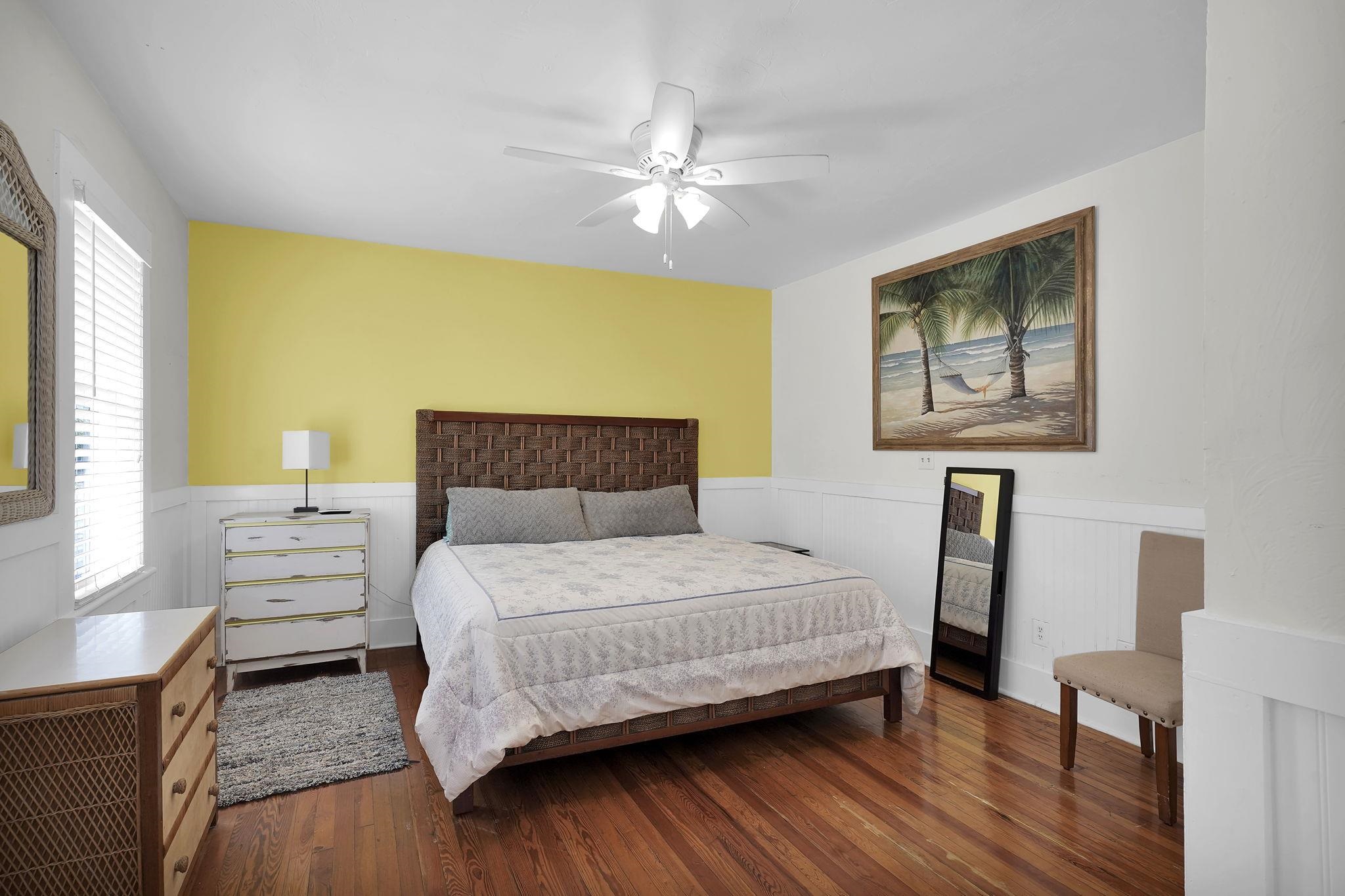 75 Cedar Street St. Augustine, FL 32084 - Photo 41 of 56 a bedroom with a bed and a chandelier