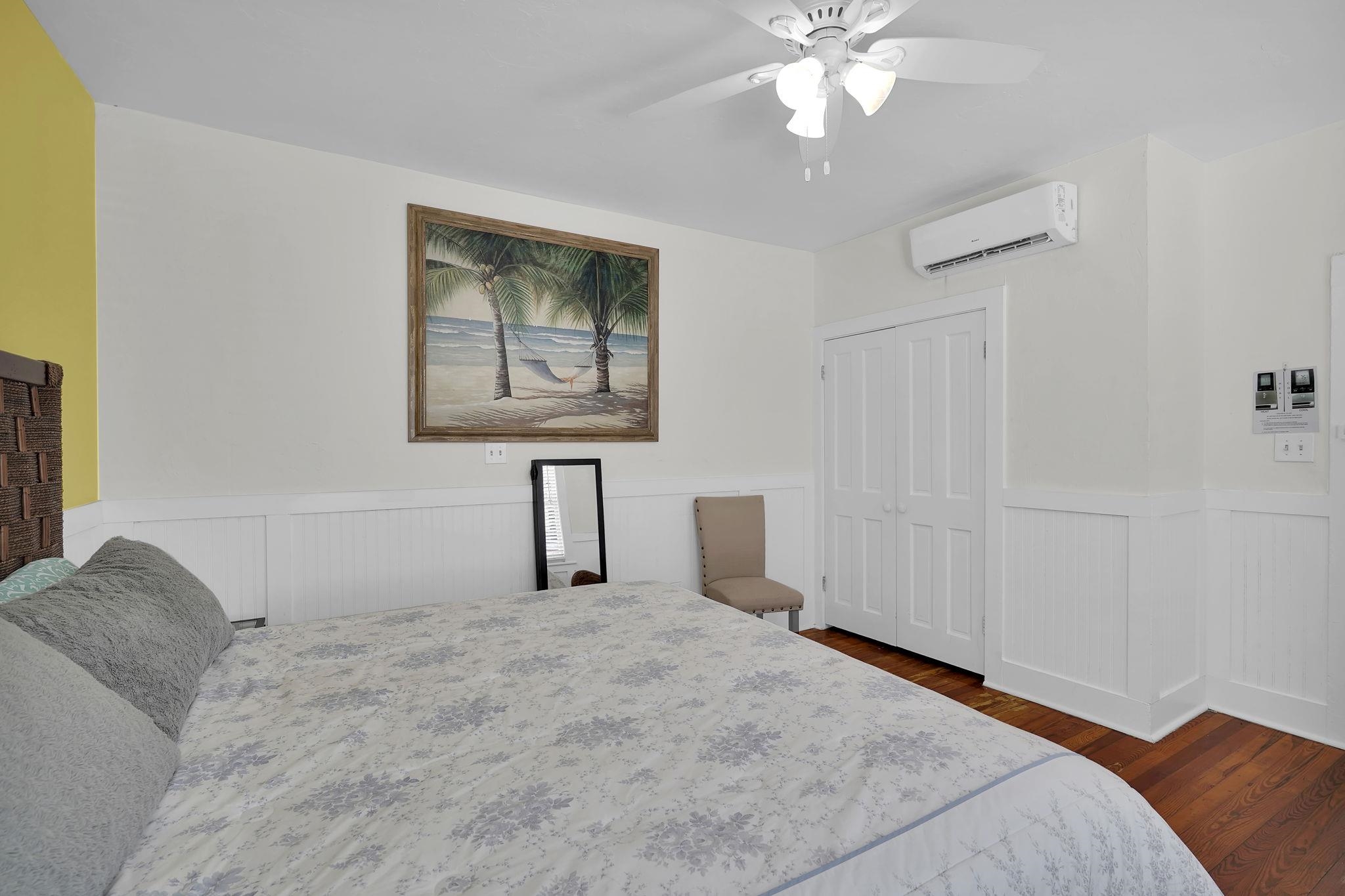 75 Cedar Street St. Augustine, FL 32084 - Photo 43 of 56 a bedroom with a bed and a chandelier