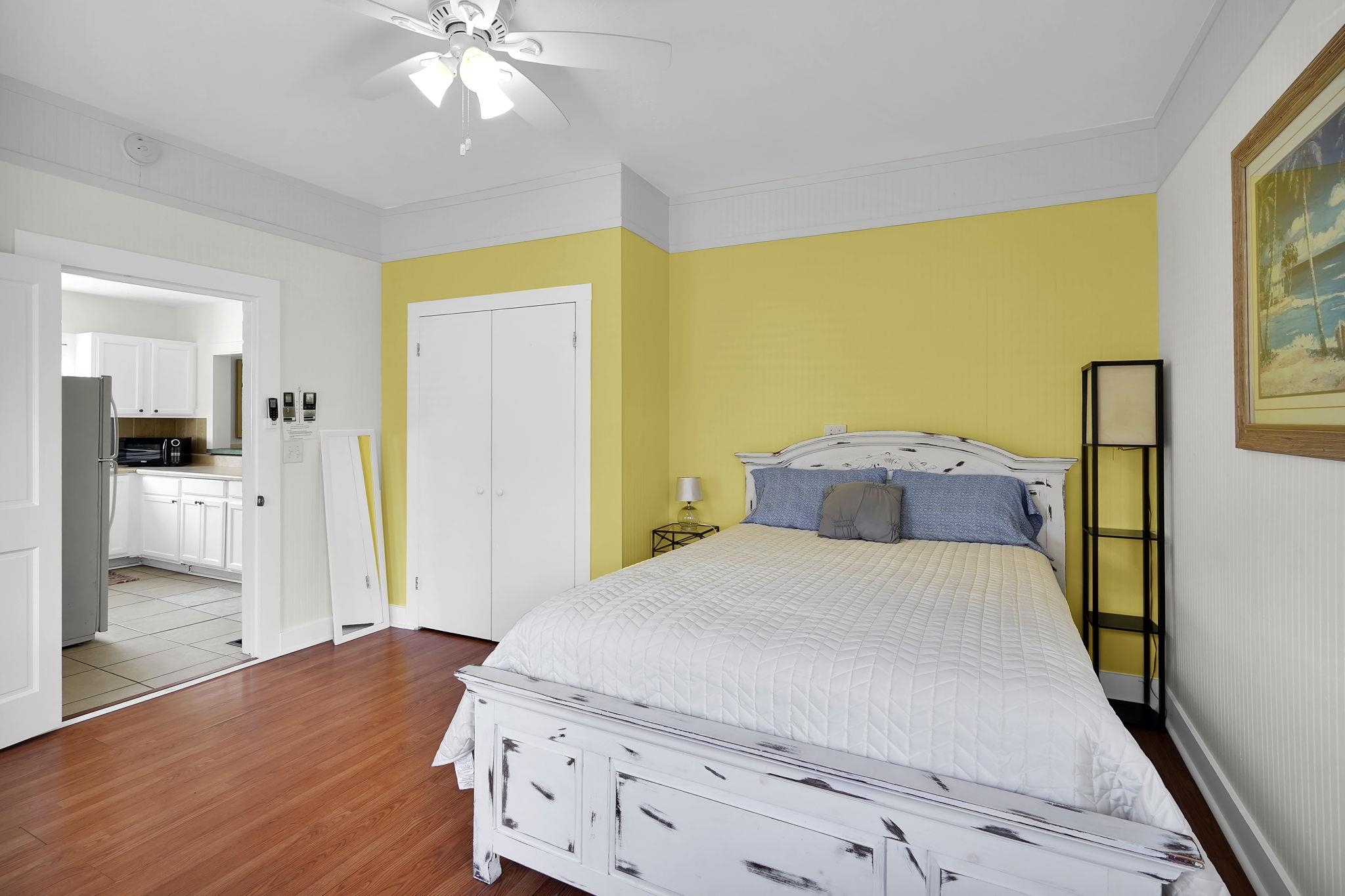 75 Cedar Street St. Augustine, FL 32084 - Photo 48 of 56 a bedroom with a bed and a chandelier