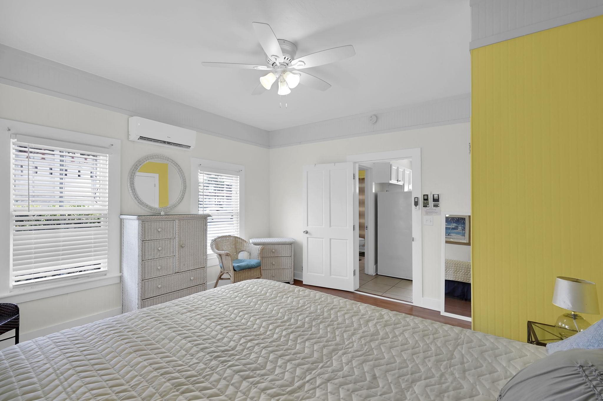 75 Cedar Street St. Augustine, FL 32084 - Photo 49 of 56 a bedroom with a bed and dresser with mirror