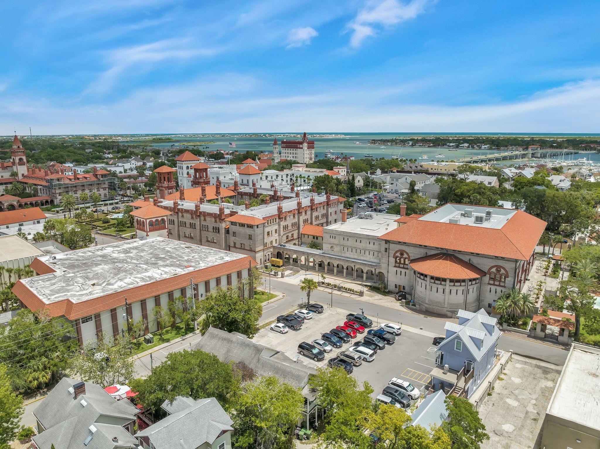 75 Cedar Street St. Augustine, FL 32084 - Photo 53 of 56 an aerial view of a city with lots of residential buildings ocean and mountain view in back