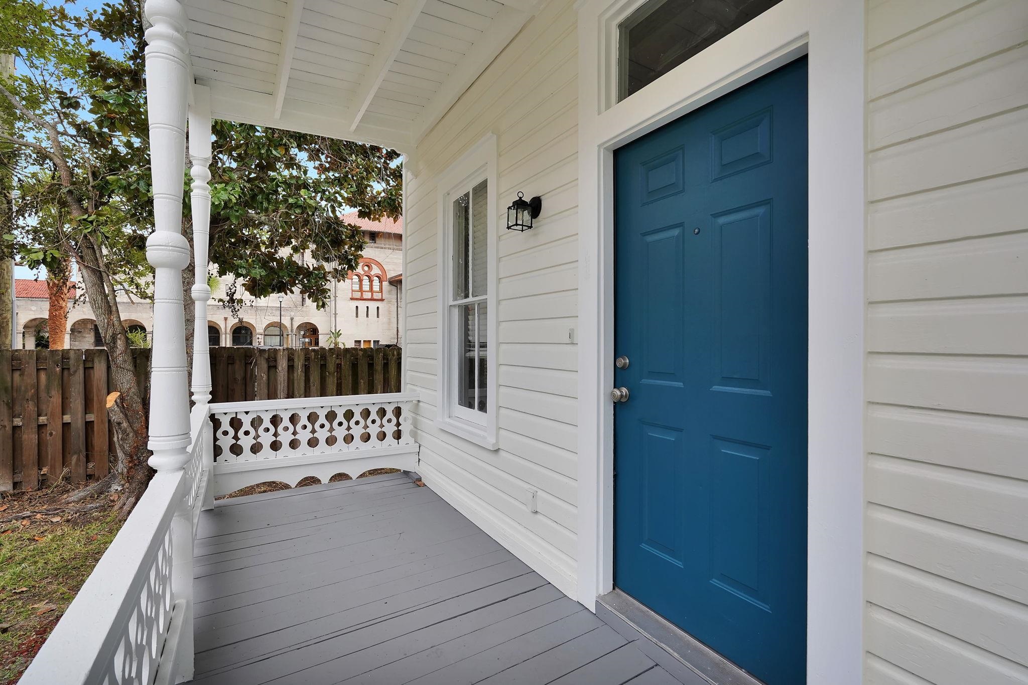75 Cedar Street St. Augustine, FL 32084 - Photo 6 of 56 a view of a porch with wooden floor and outdoor seating