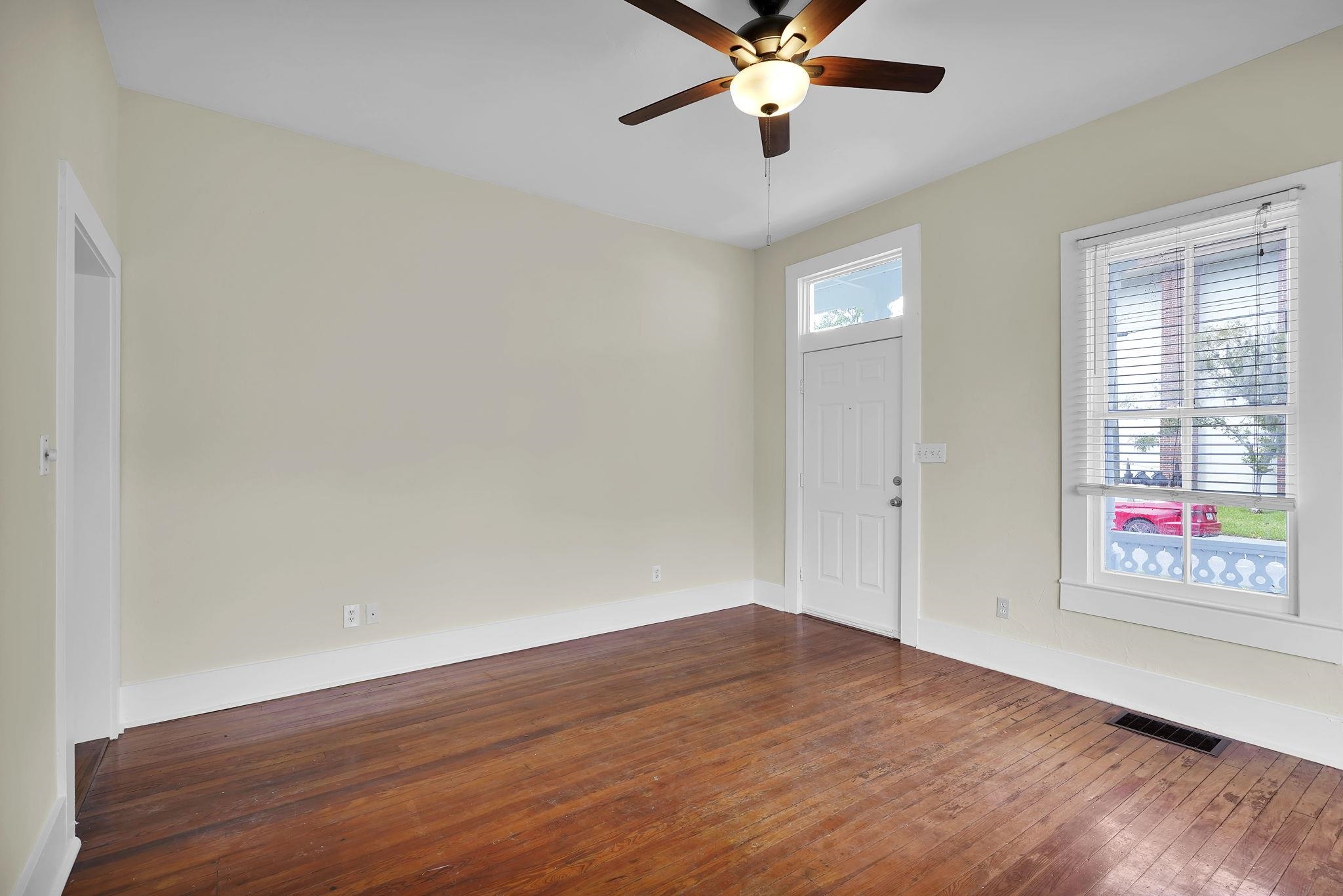 75 Cedar Street St. Augustine, FL 32084 - Photo 9 of 56 an empty room with wooden floor fan and windows