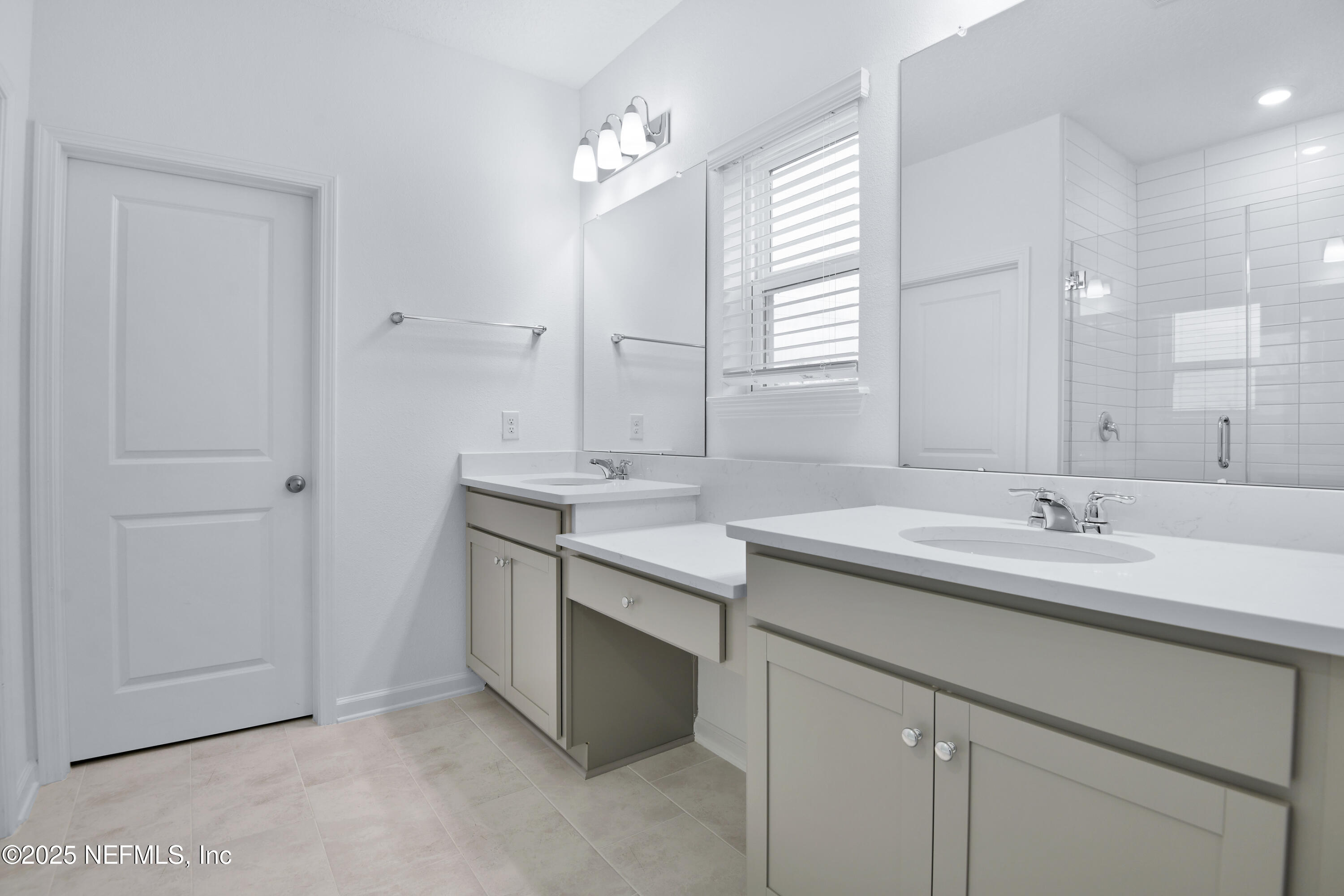 45 Bird Watch Court St. Augustine, FL 32092 - Photo 19 of 37 a bathroom with a granite countertop sink and a mirror