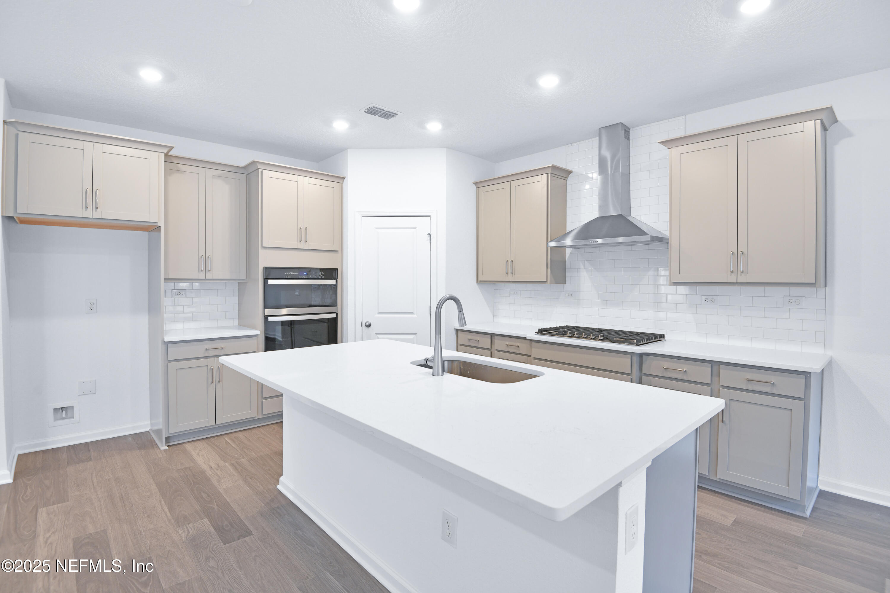 45 Bird Watch Court St. Augustine, FL 32092 - Photo 7 of 37 a kitchen that has a sink a stove and cabinets