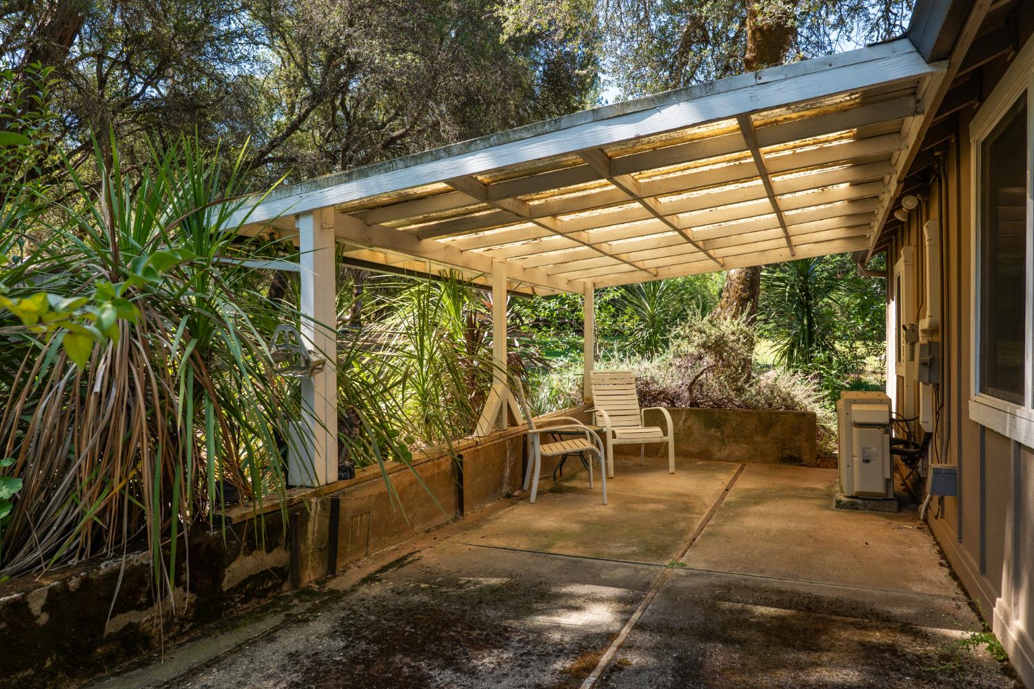 10875 Spenceville Road Penn Valley, CA 95946 - Photo 34 of 49 a view of a patio with table and chairs and potted plants
