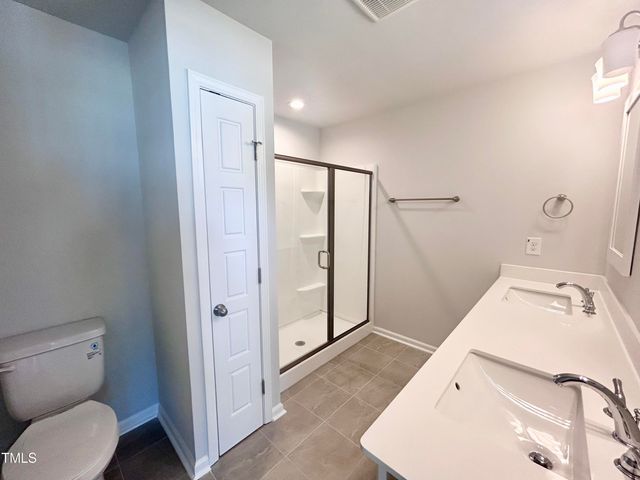 a bathroom with a sink and toilet