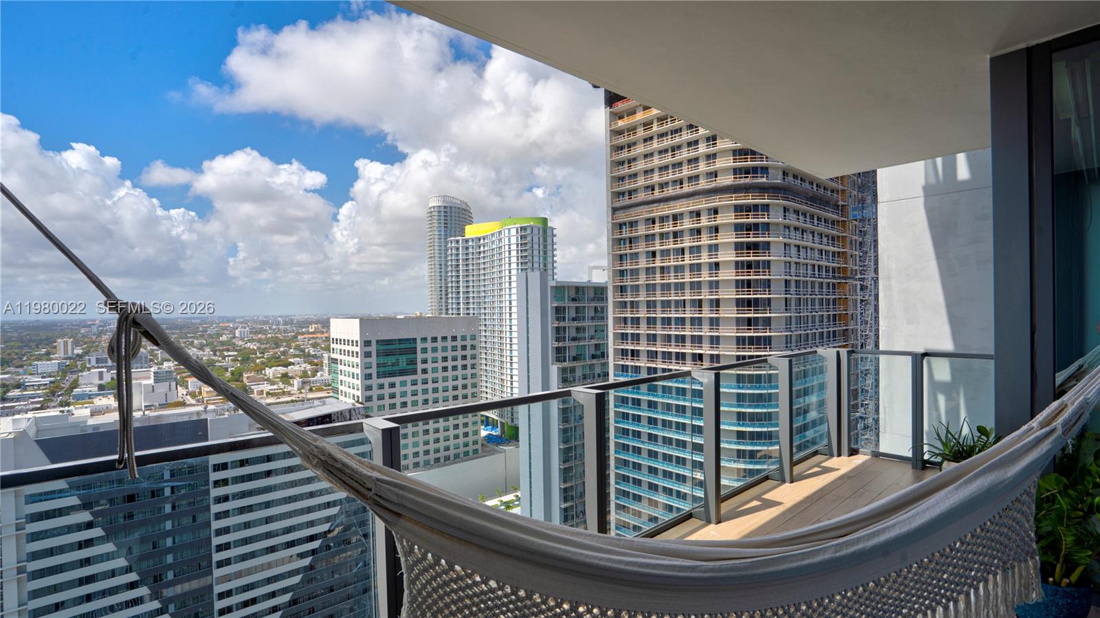 88 Southwest 7th Street, Unit 2706 Miami, FL 33130 - Photo 11 of 58 a view of balcony with a potted plant