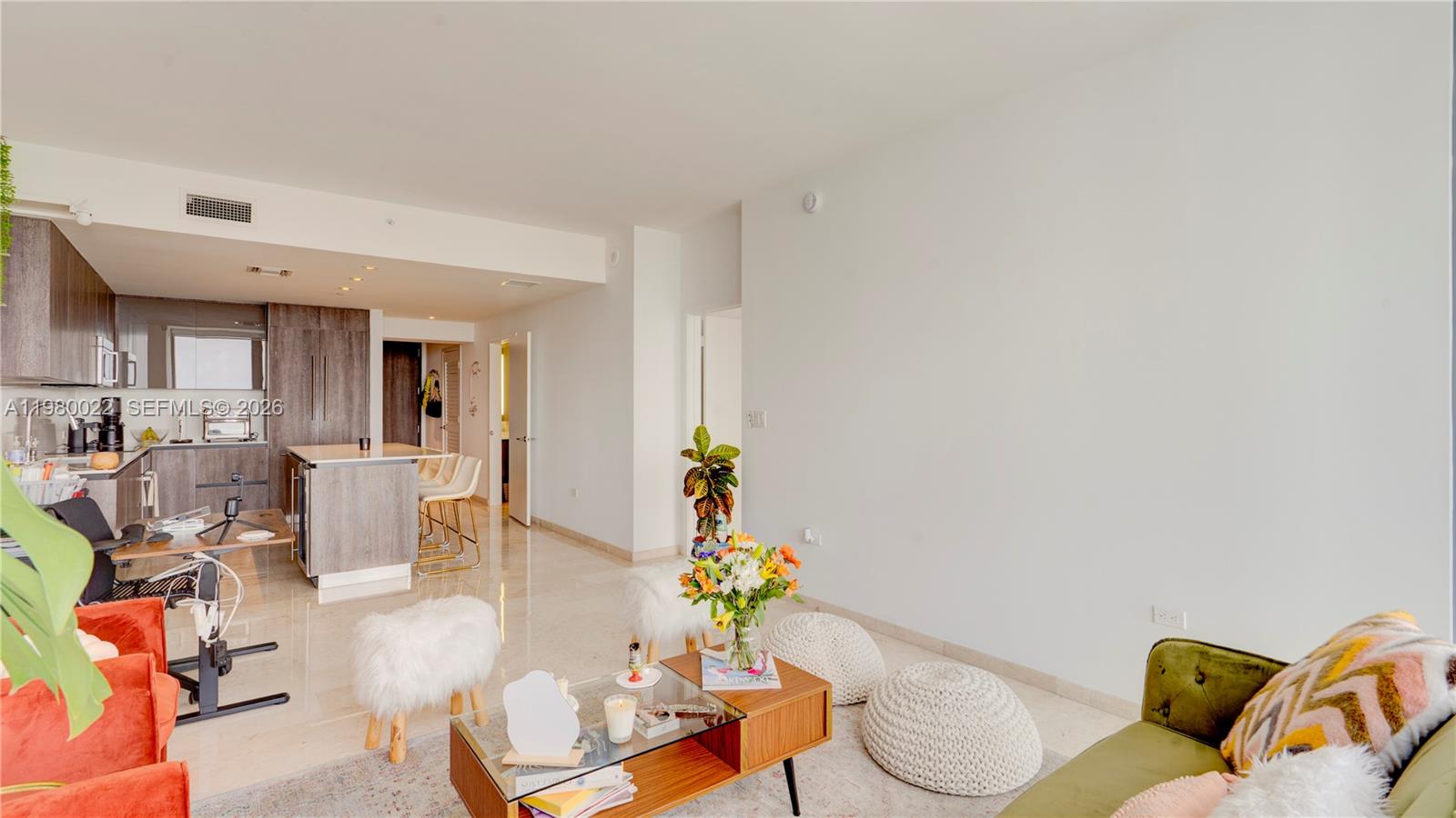 88 Southwest 7th Street, Unit 2706 Miami, FL 33130 - Photo 14 of 58 a living room with furniture and a potted plant